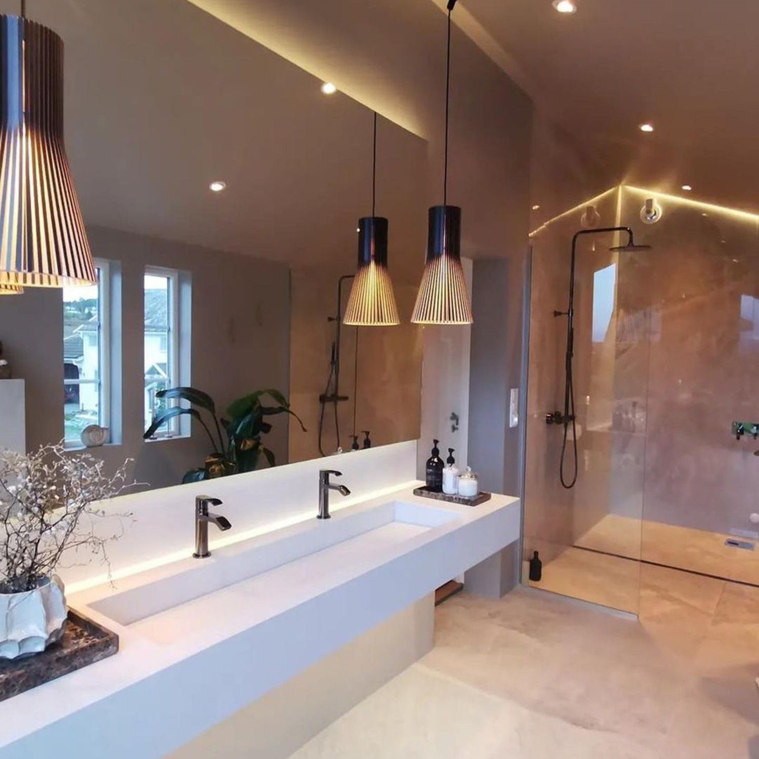 A modern and serene bathroom with neutral tones.