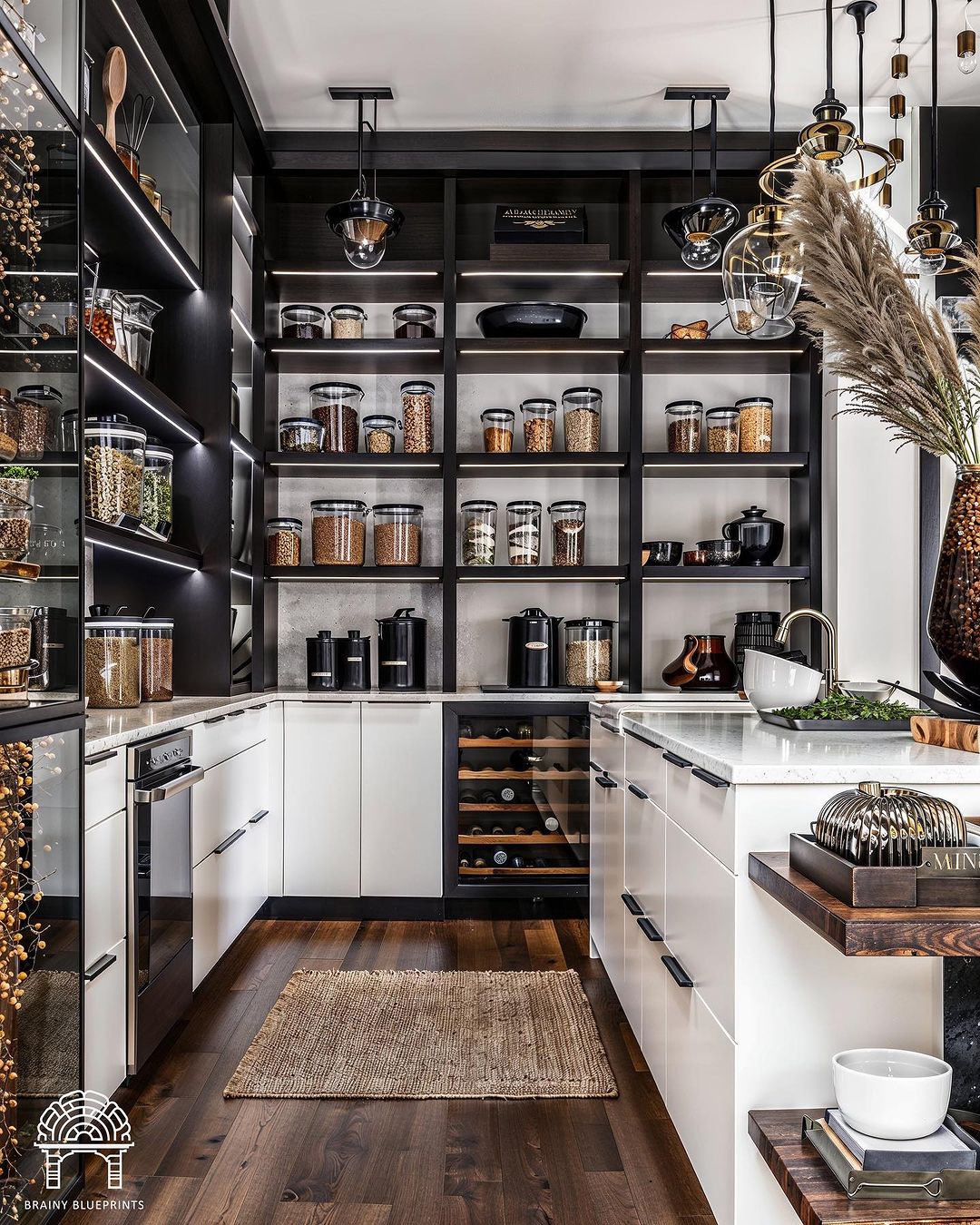 A modern black and white pantry design with dark wood accents