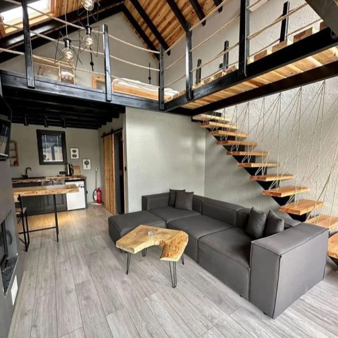 A modern and functional living room with a loft