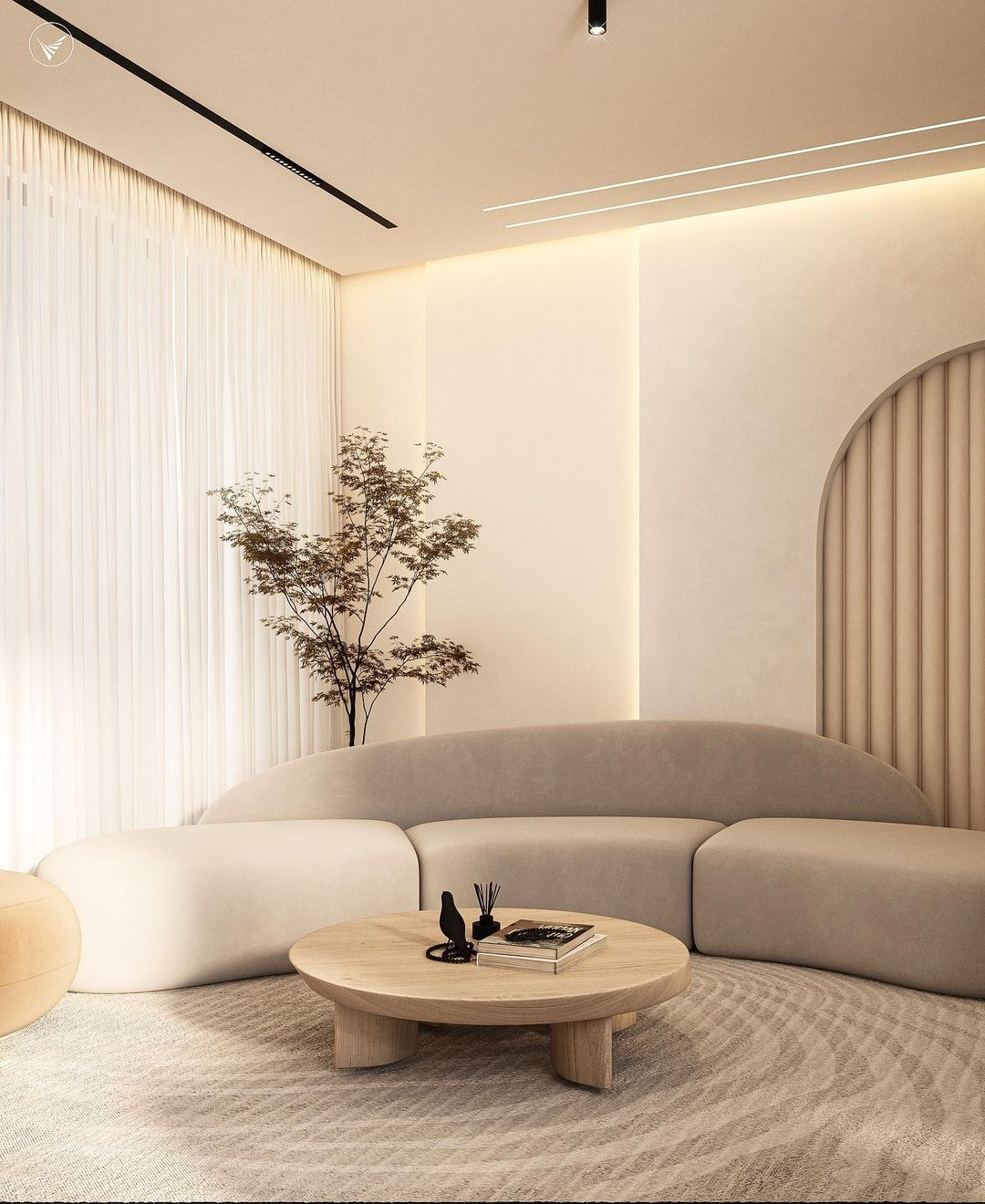 A modern living room with subtle curves and neutral tones.