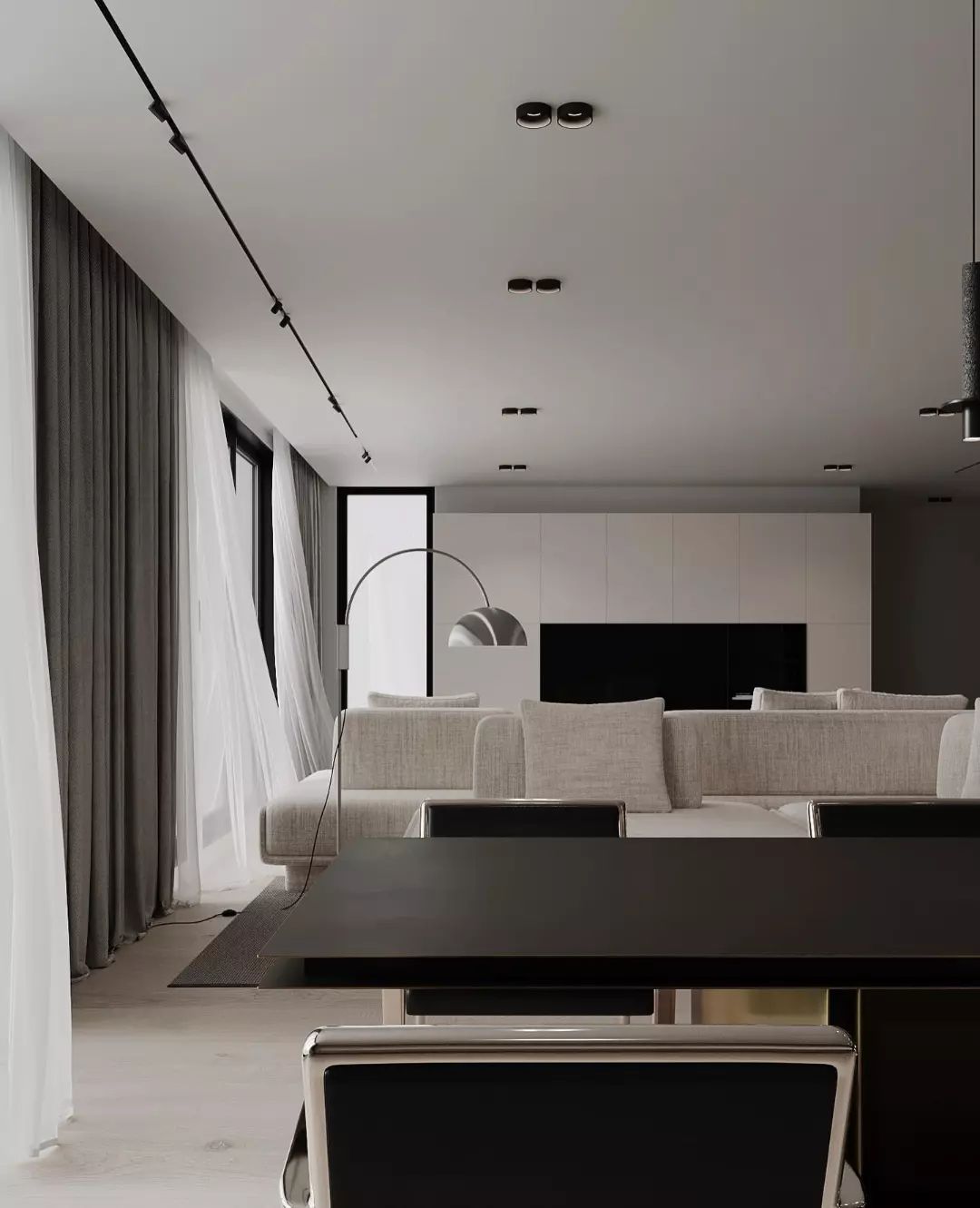 A modern minimalist living room designed with a monochromatic palette