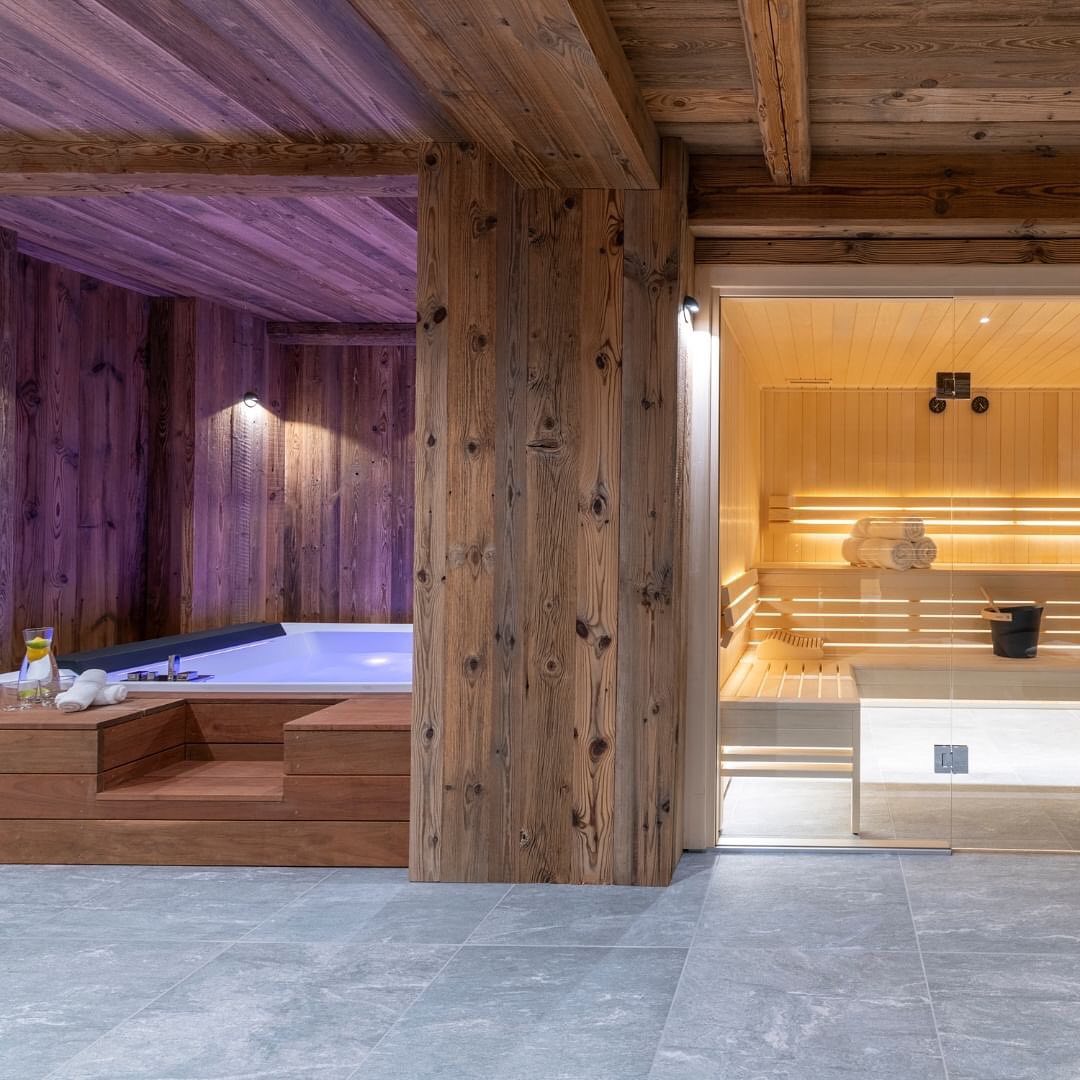 A luxuriously appointed wooden sauna and bath space