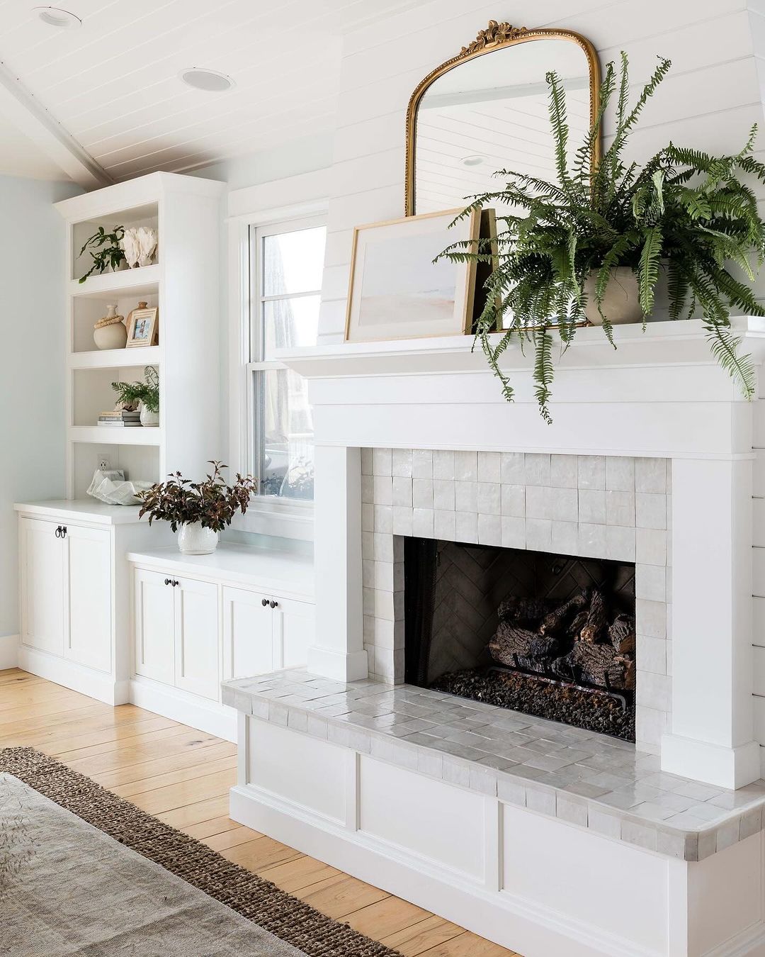 A thoughtfully designed fireplace area with built-in cabinetry