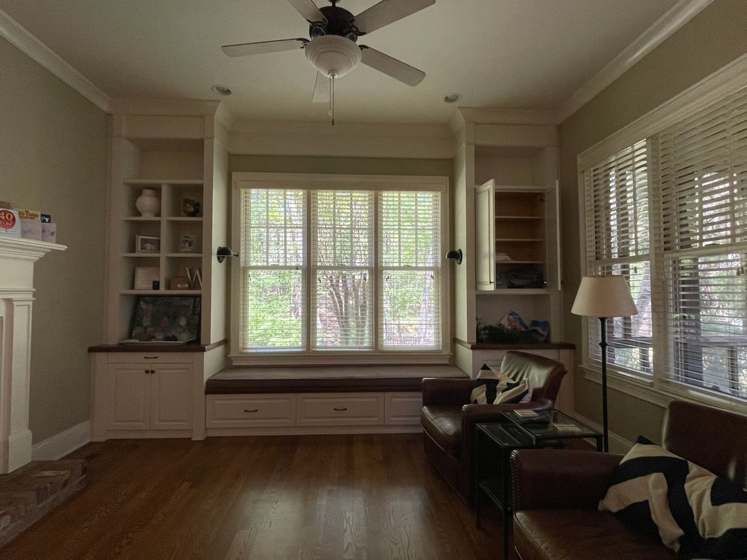 A cozy and well-lit living room with wooden floors