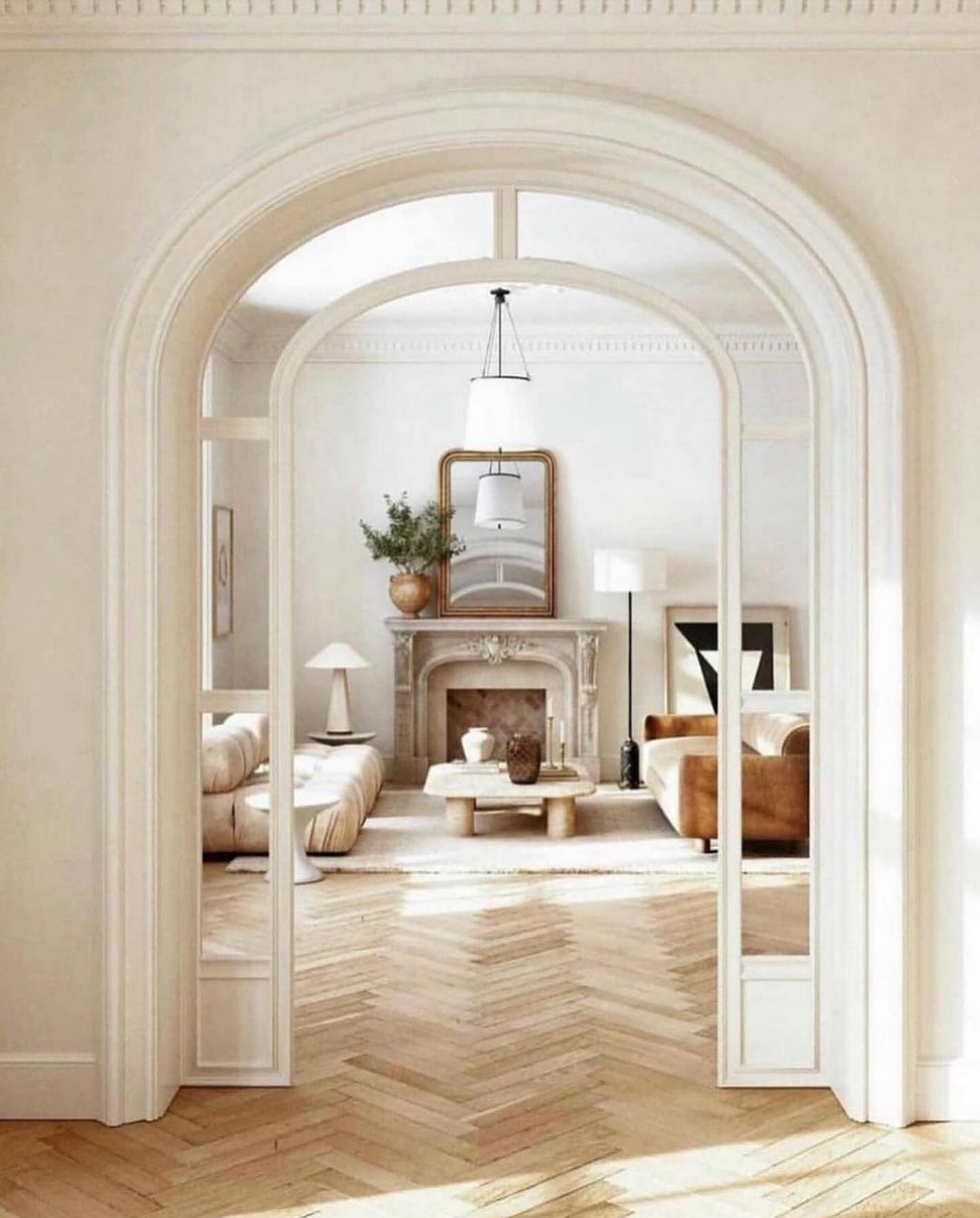 A tastefully designed living space showcasing an arched doorway