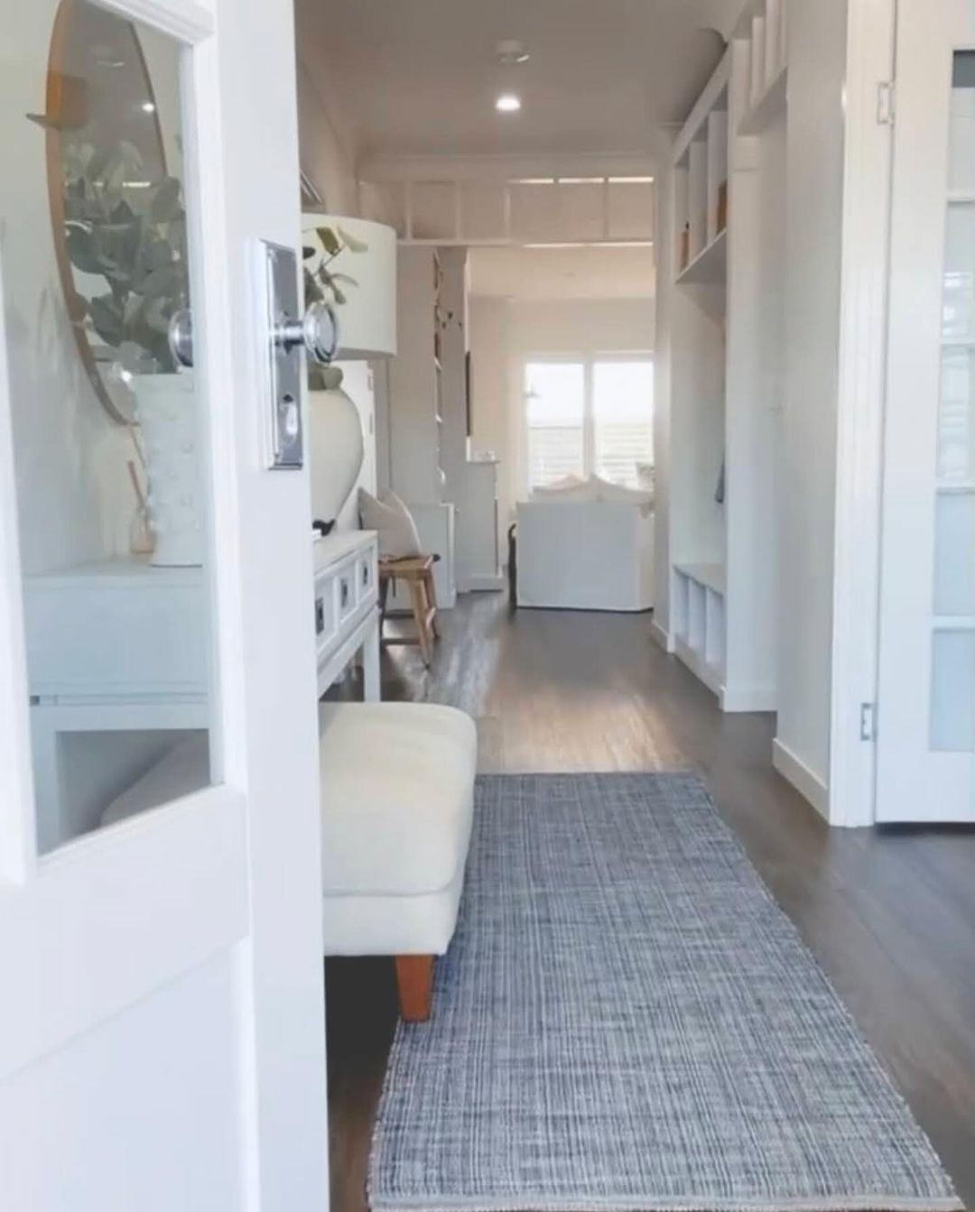 A sleek and modern hallway showcasing a refined sense of style with its minimalist decor