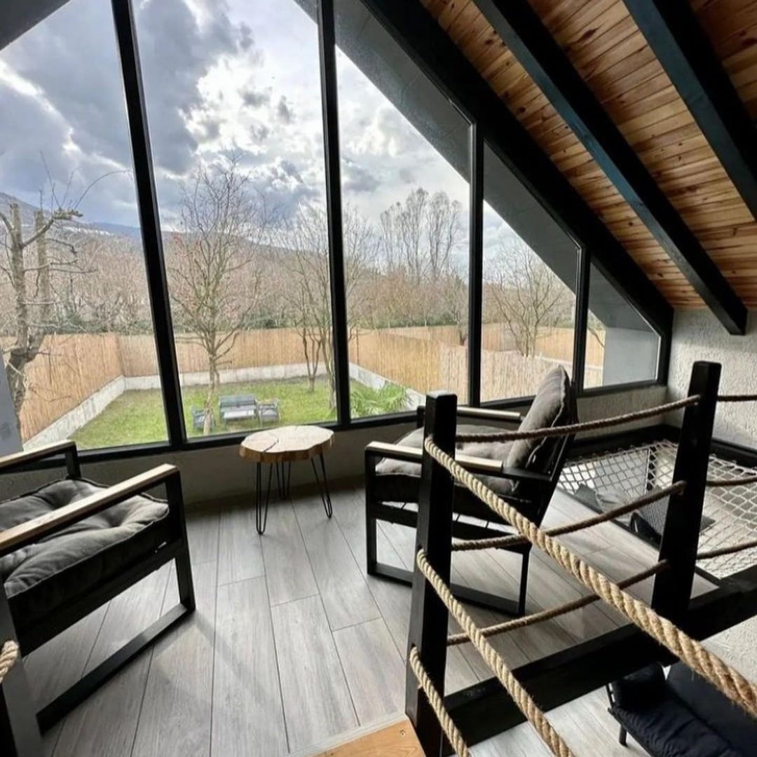 A cozy nook with floor-to-ceiling windows