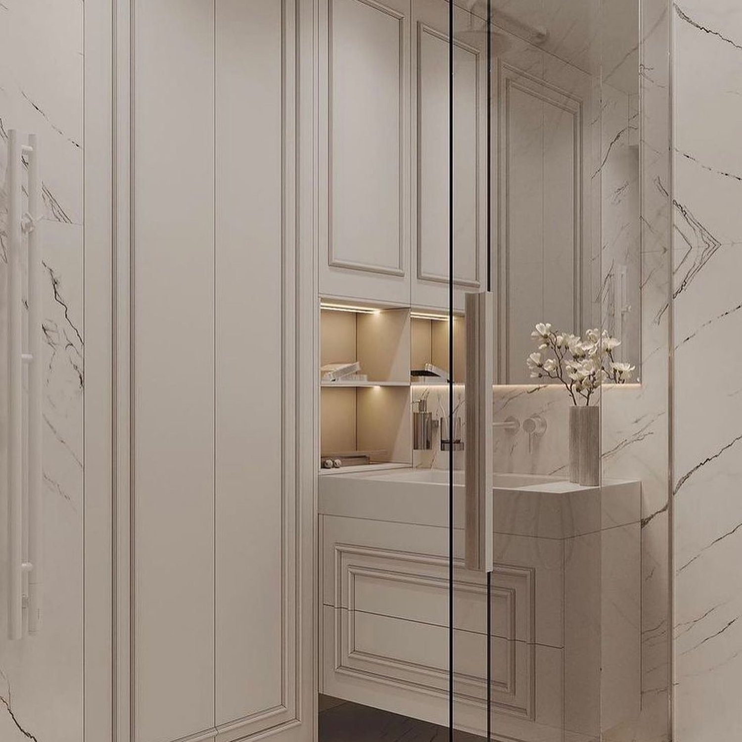 Elegant bathroom featuring marble walls and a glass shower divider