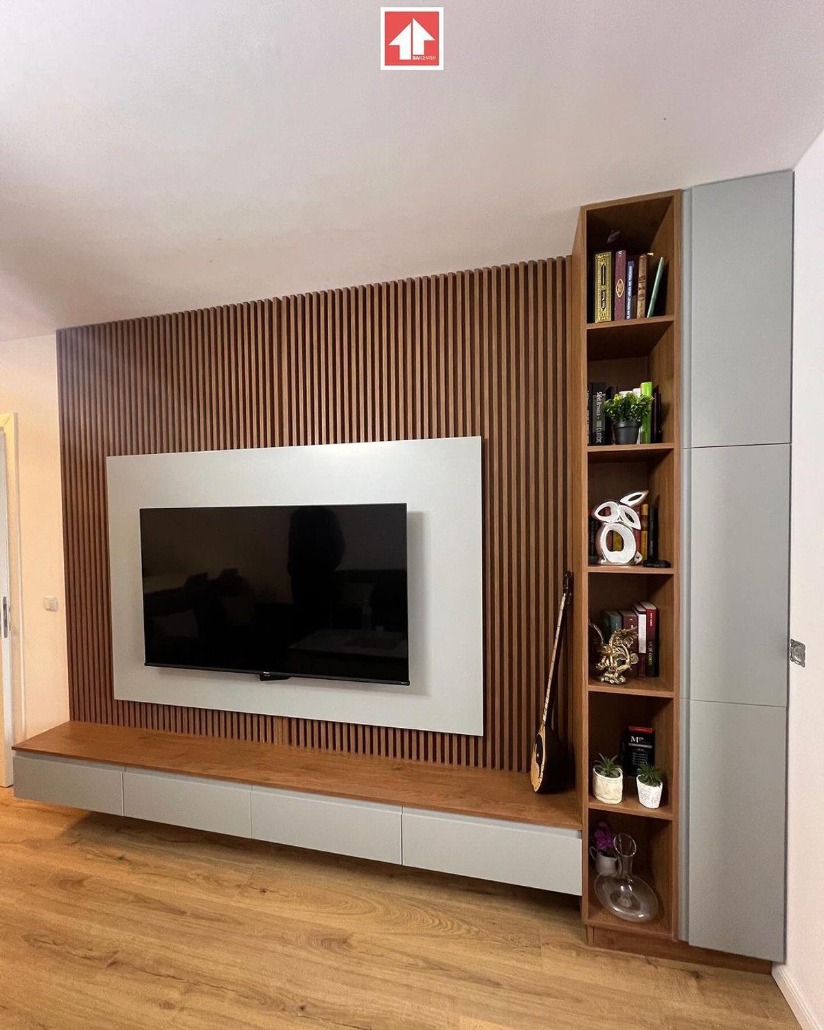 A neatly organized modern living room entertainment unit