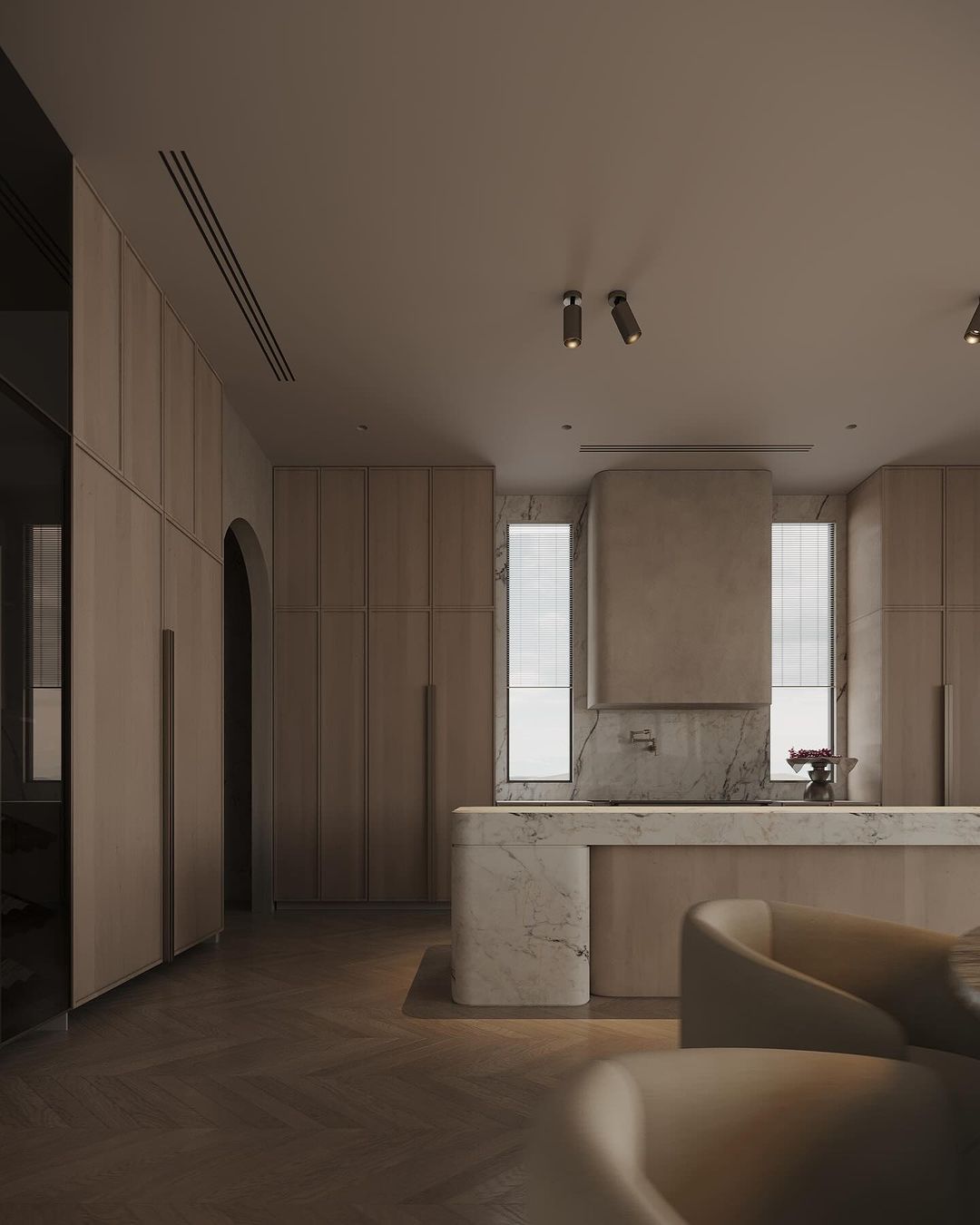 A modern kitchen with sleek wooden cabinetry and marble accents