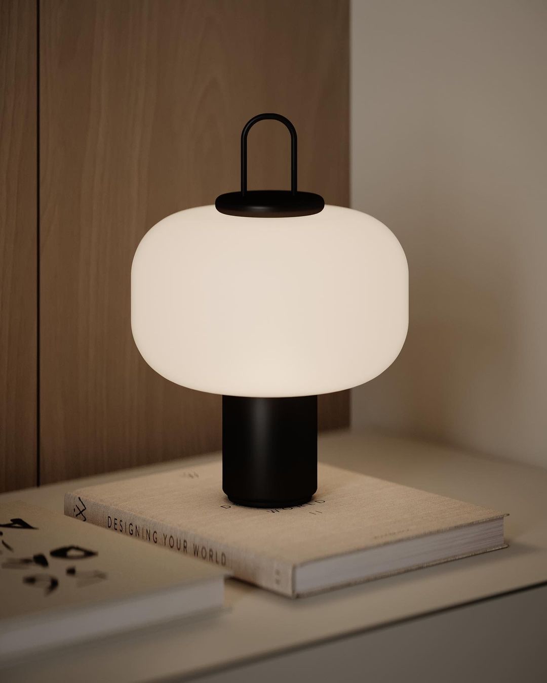 Stylish table lamp on book