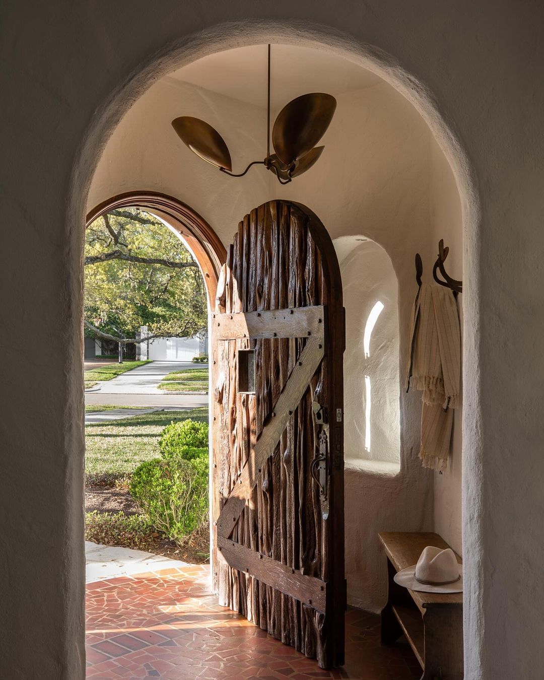 Charming arched doorway with a unique wooden door