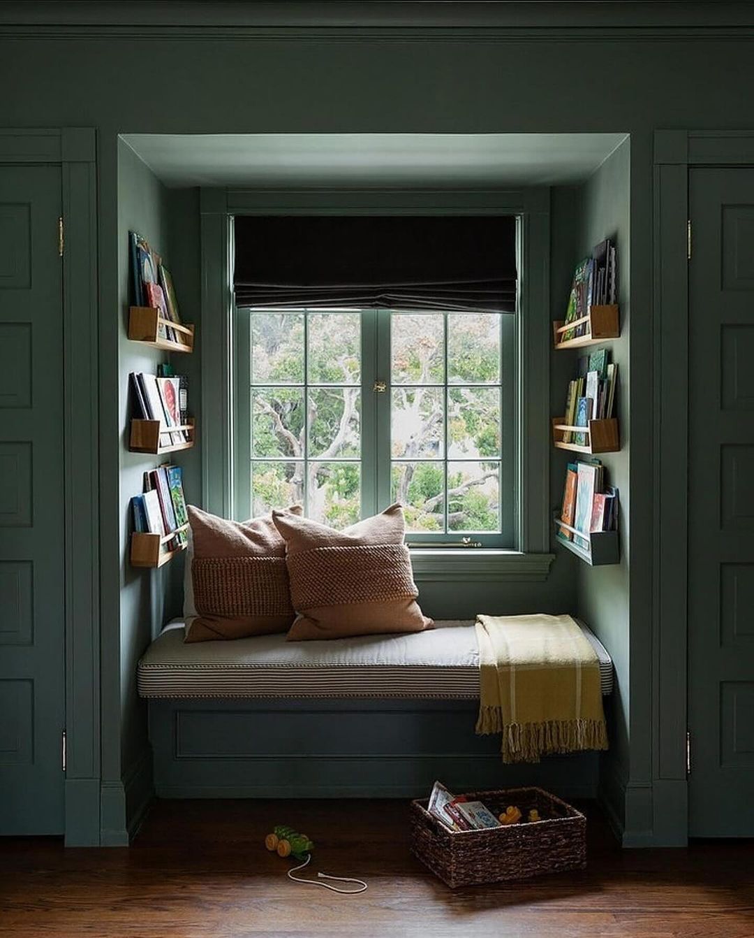 Cozy reading nook with built-in bench and bookshelves