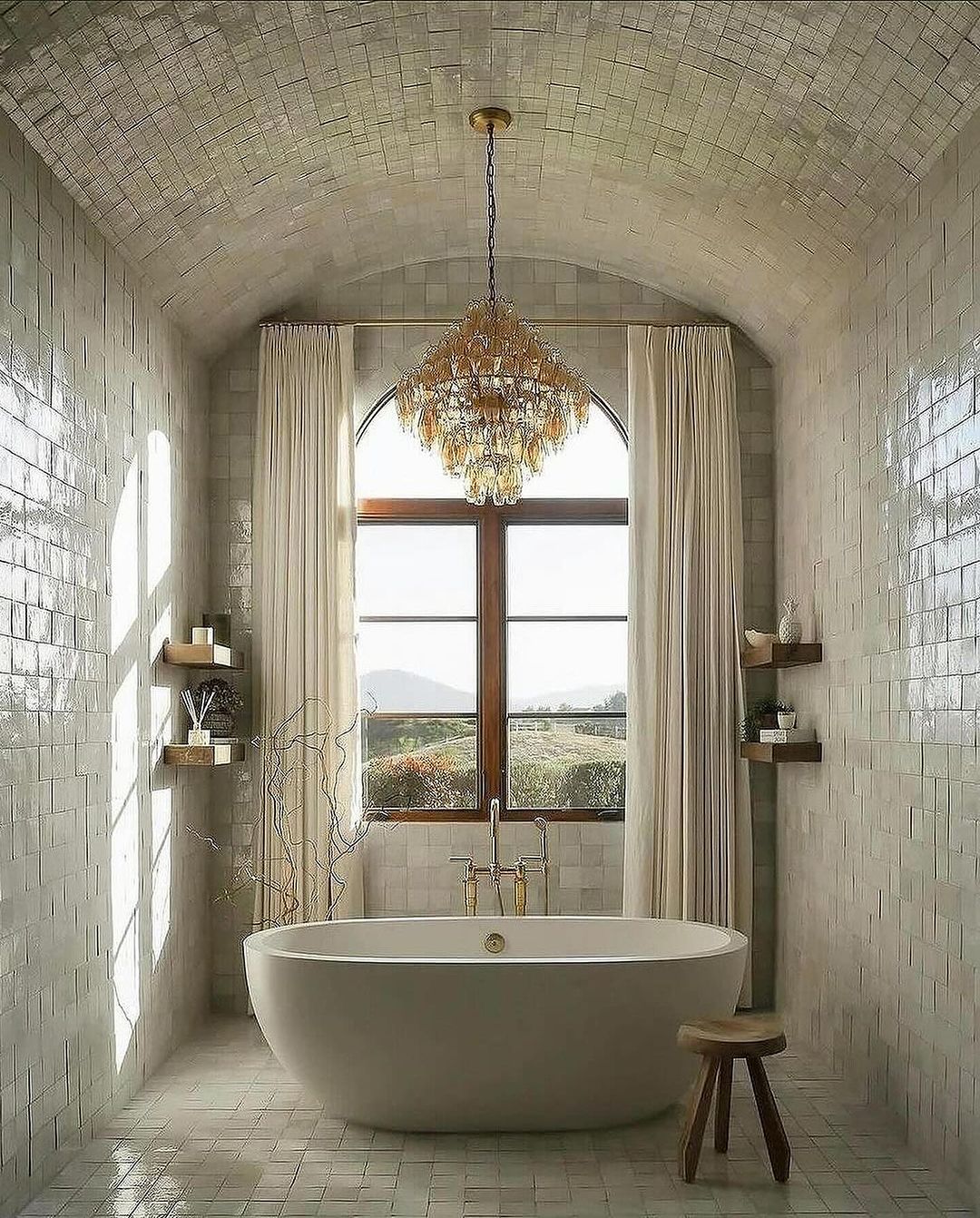 A spacious bathroom with a barrel-vaulted ceiling and free-standing tub