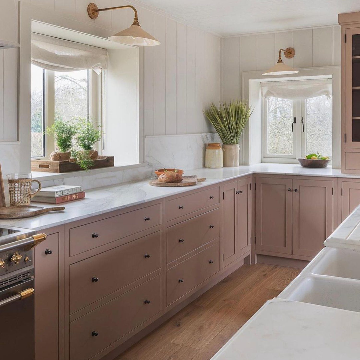 Elegant kitchen design featuring blush cabinets