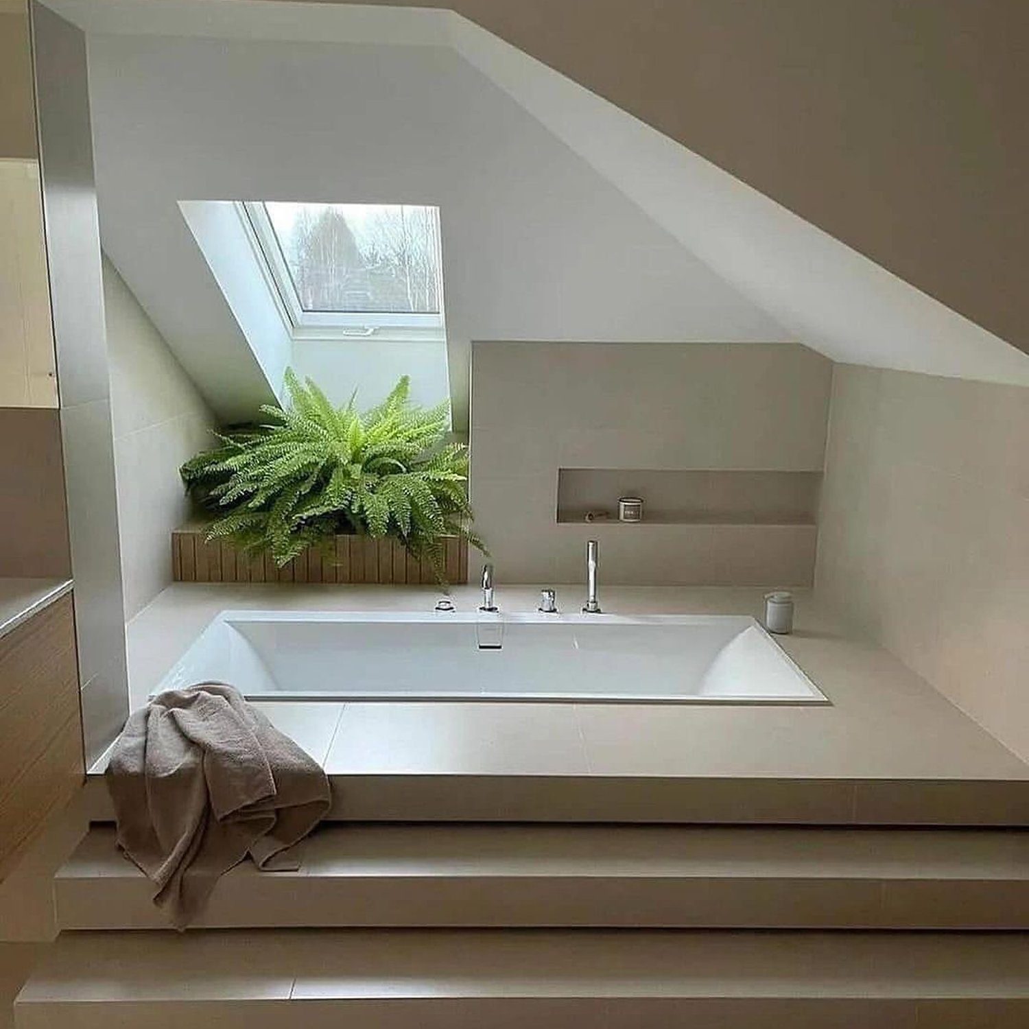 A serene and modern bathroom with skylight