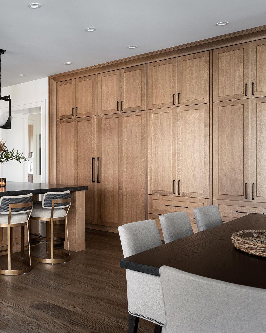 A modern kitchen featuring seamless wood cabinetry