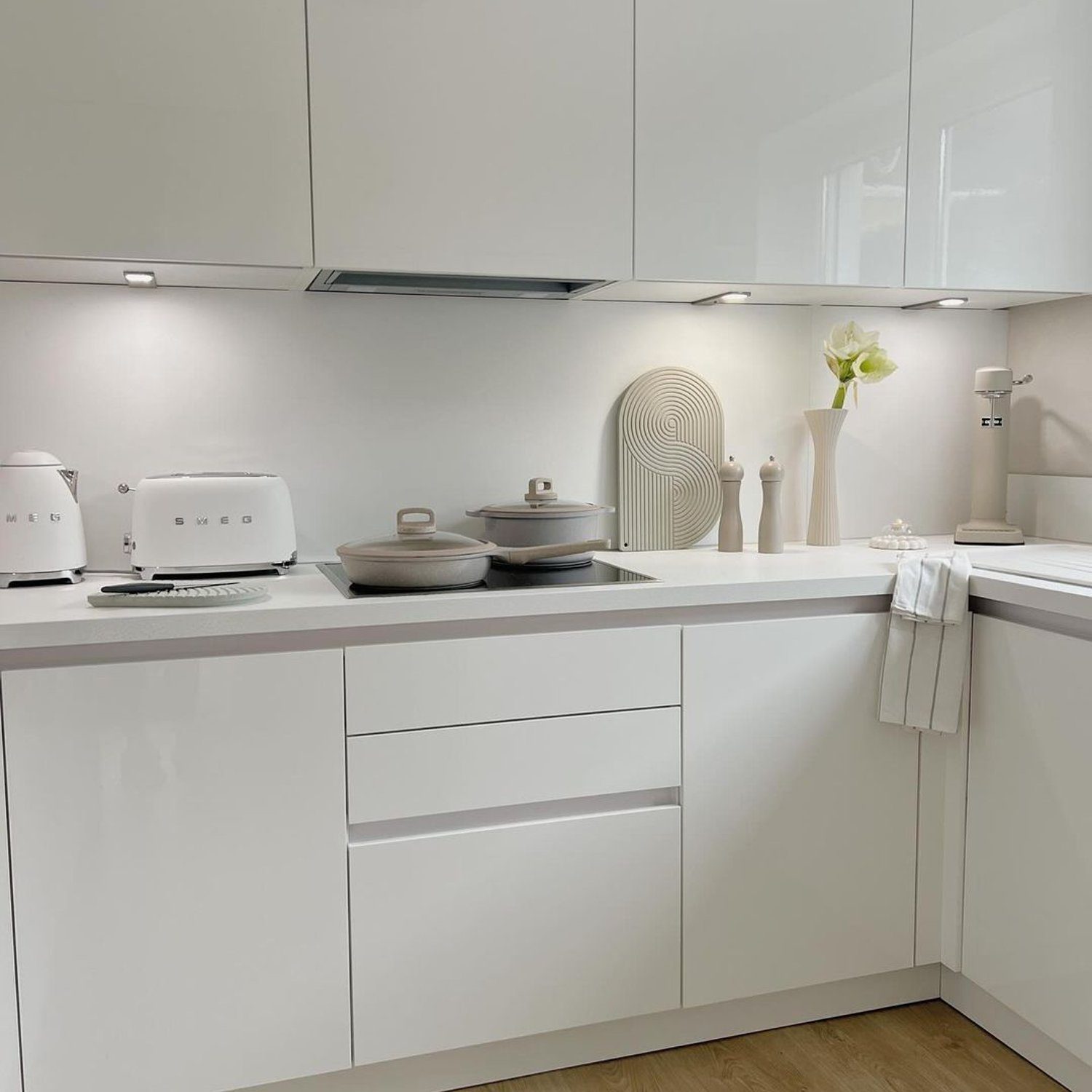 Modern minimalist kitchen with sleek white cabinetry