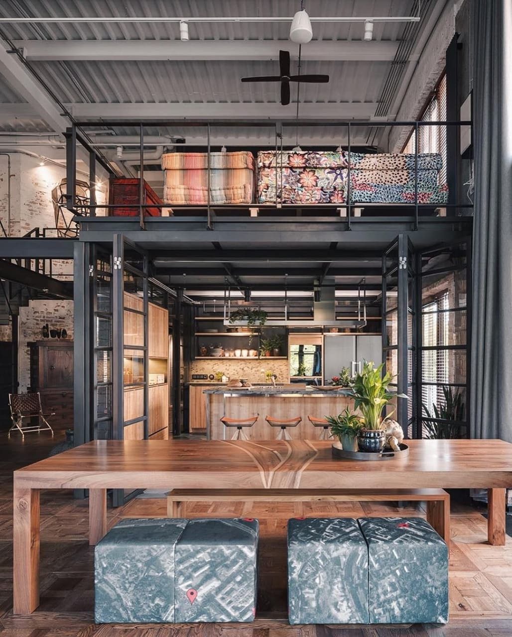 A tastefully designed loft-style kitchen with high ceilings