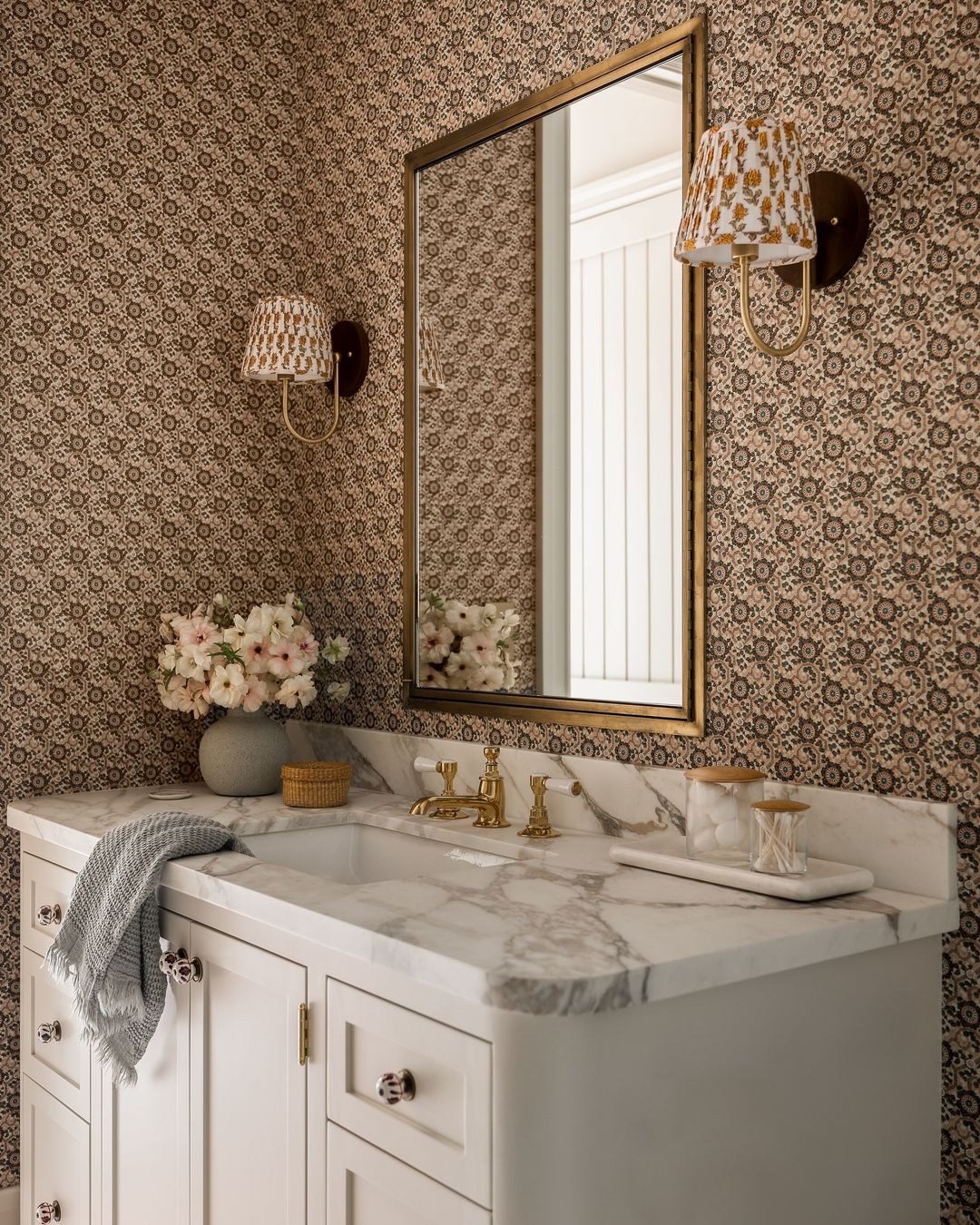 Charming traditional style bathroom with floral wallpaper