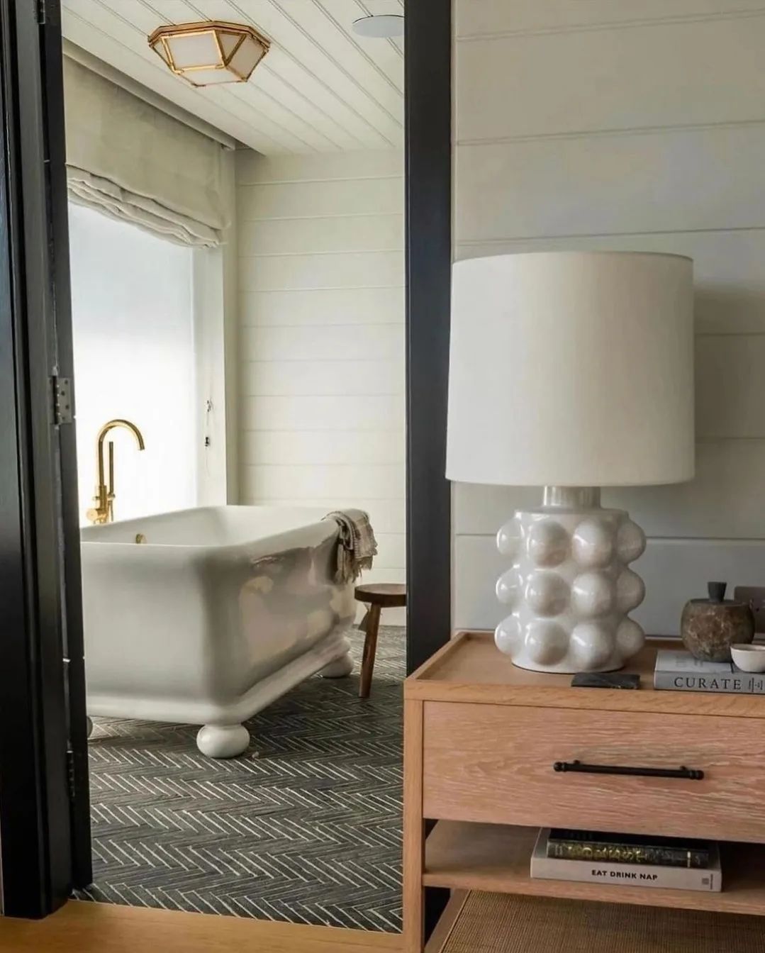 A tastefully designed bathroom with a classic free-standing bathtub