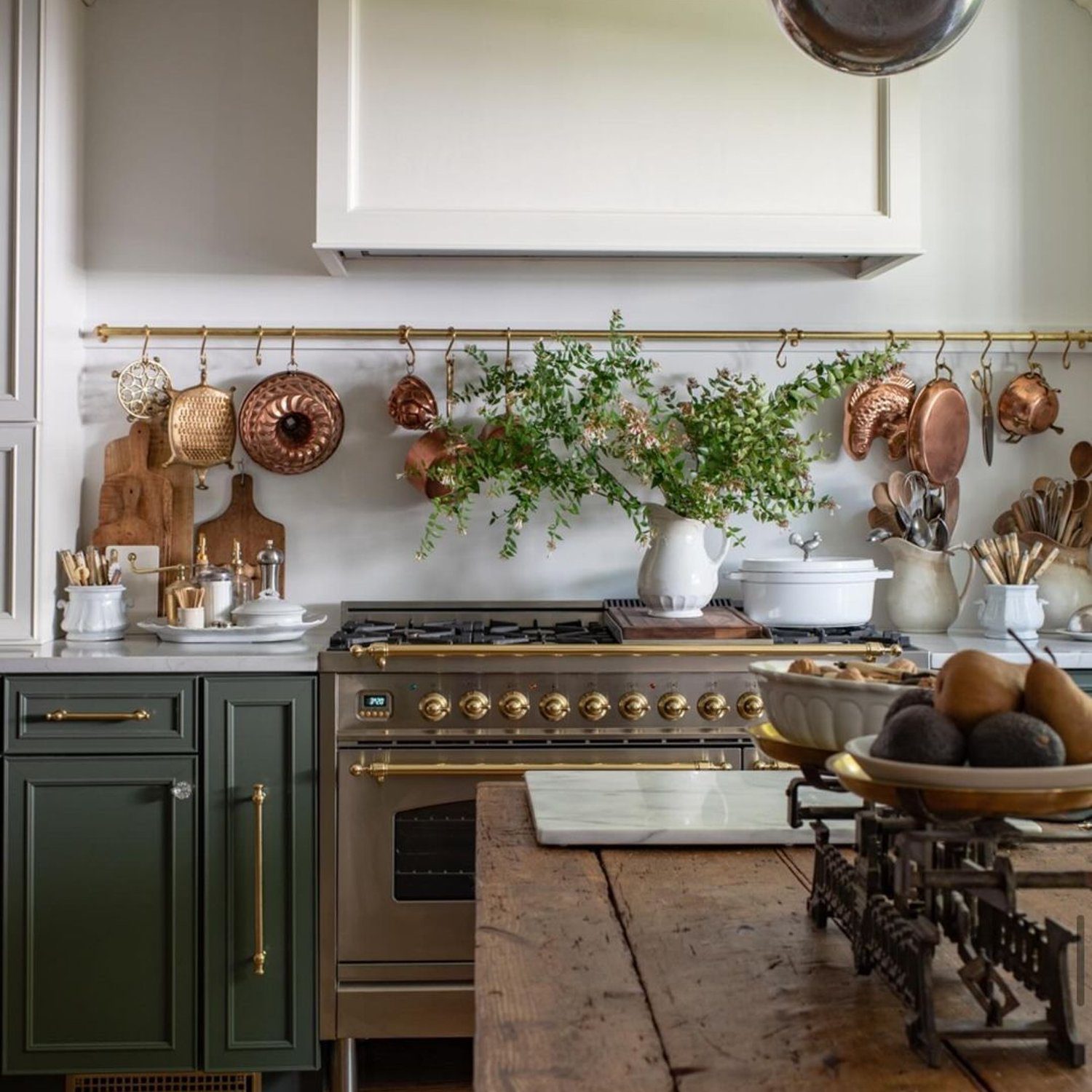 Elegant and traditional kitchen with brass and copper accents