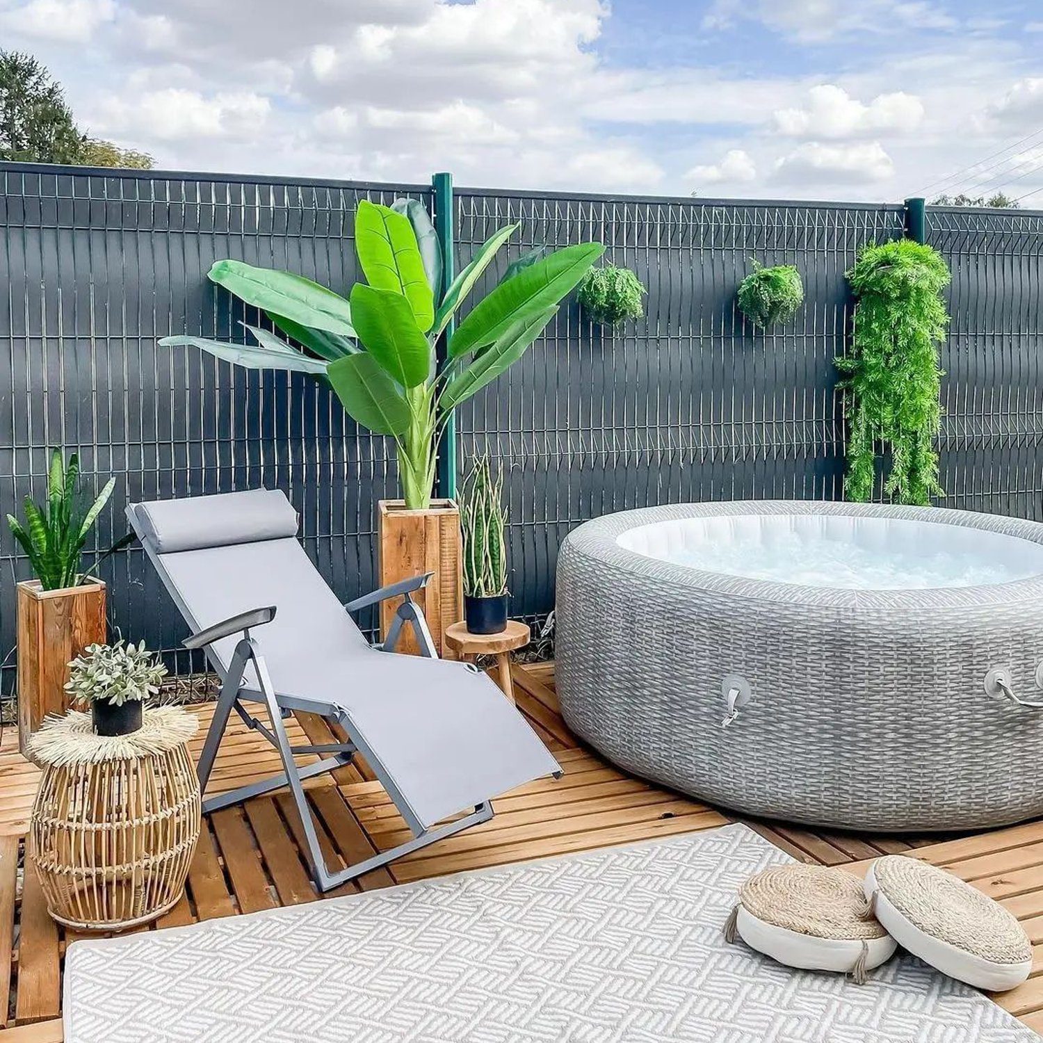 Cozy outdoor relaxation space with a hot tub