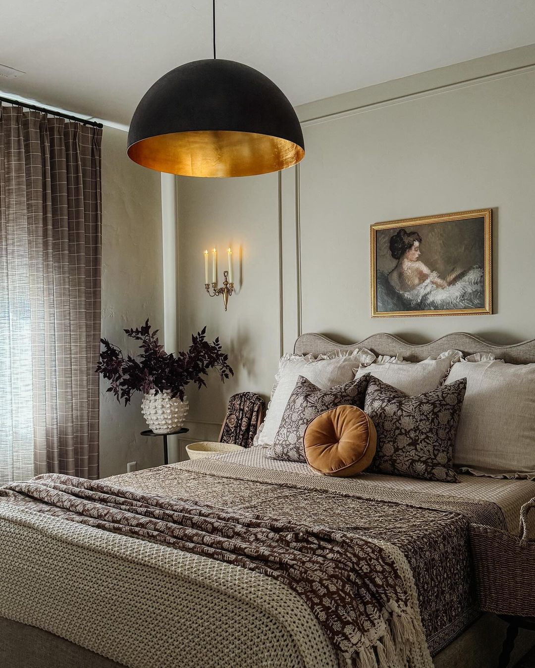 A tastefully decorated bedroom with a touch of classic elegance