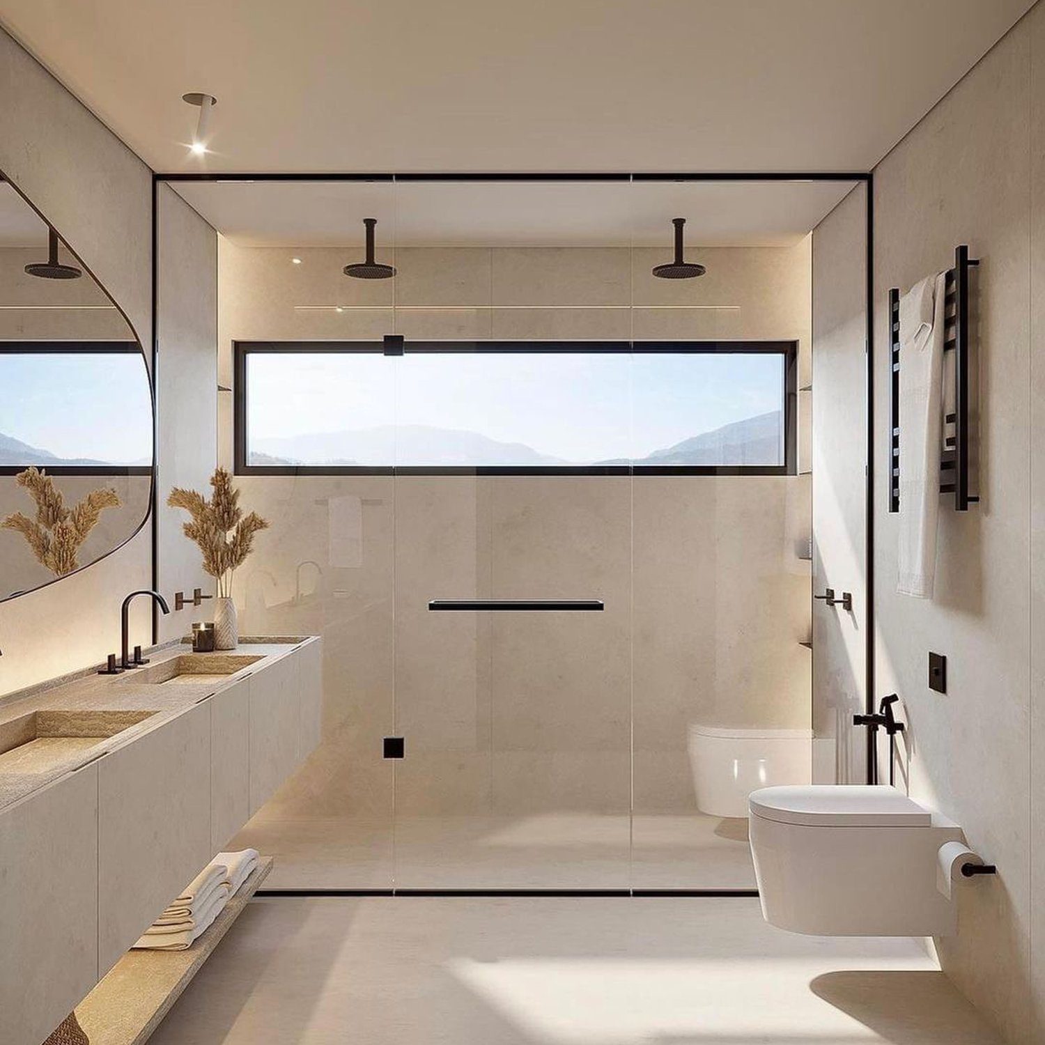 A modern and minimalist bathroom featuring an expansive mountain view through a large window