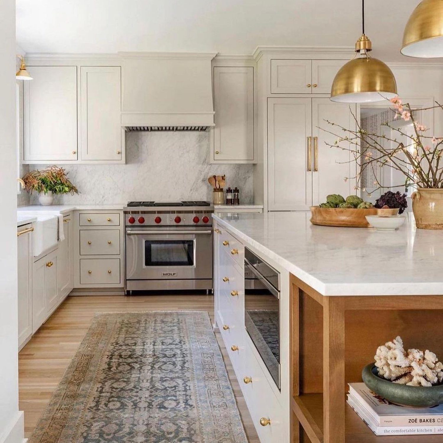 Elegant and bright kitchen with gold accents