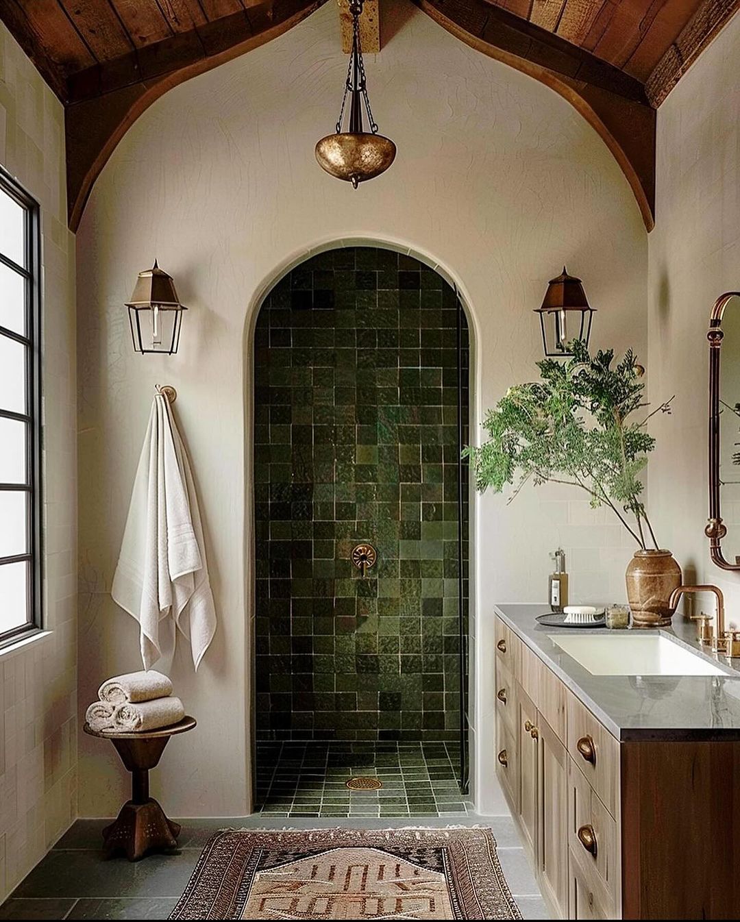 A richly textured bathroom with arched entryway