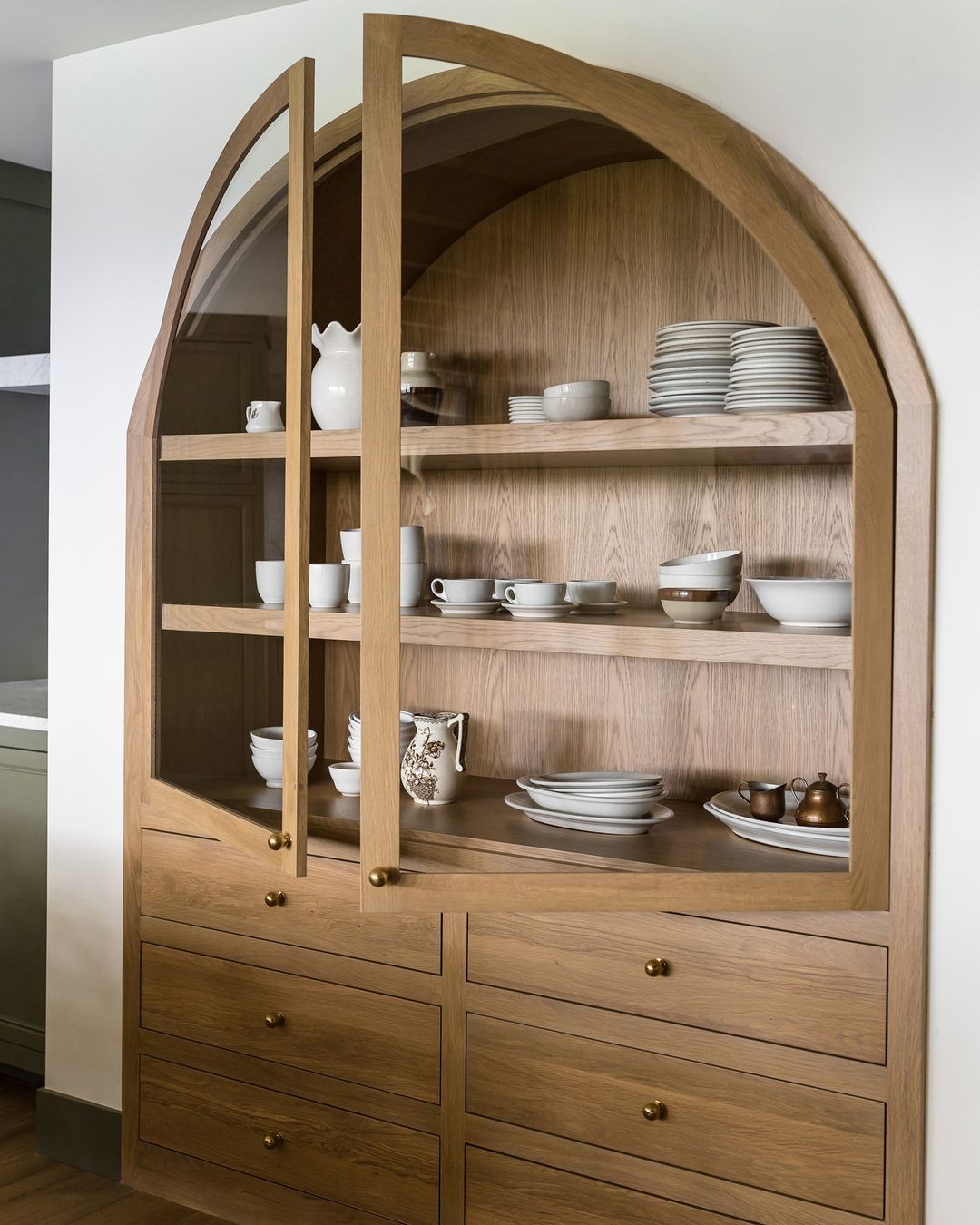 Arched wooden hutch with modern farmhouse aesthetic