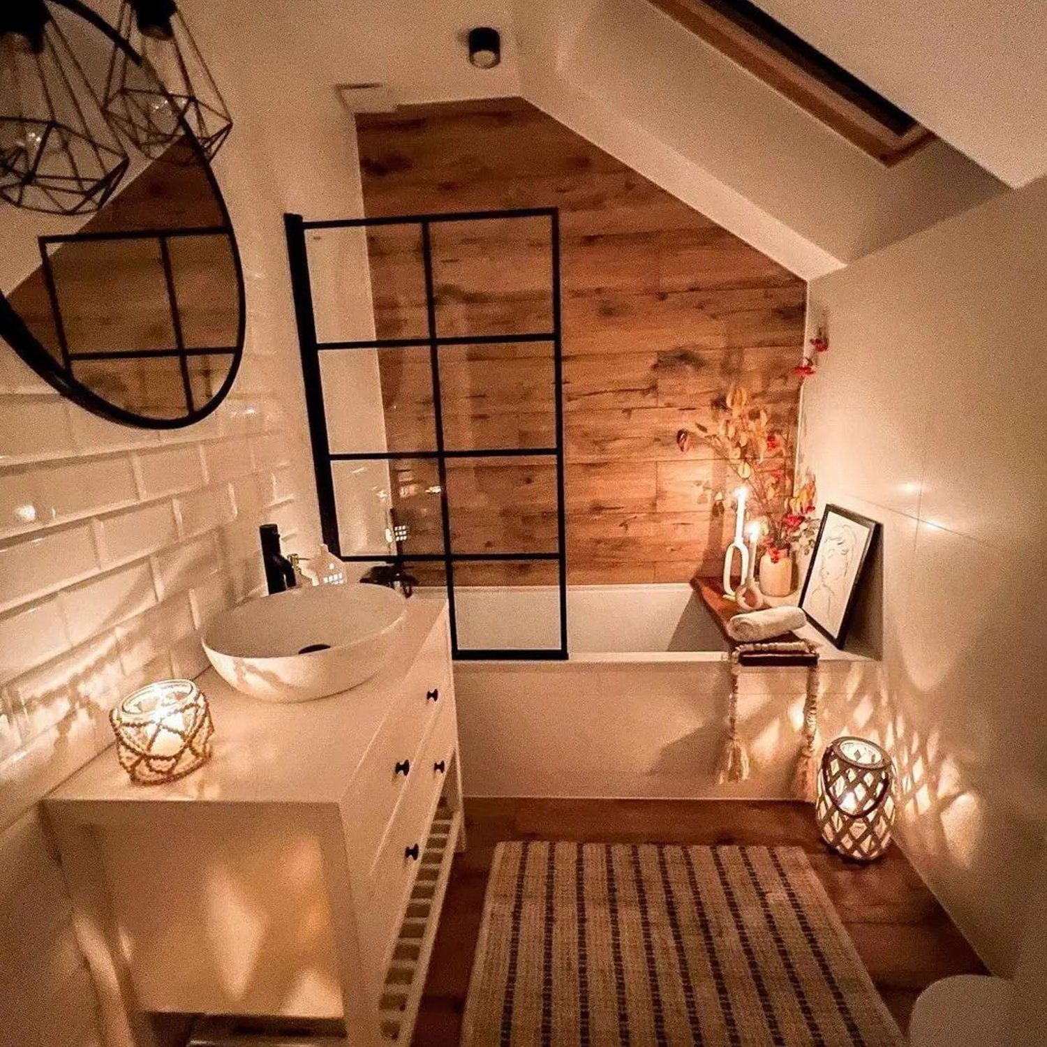 Cozy and modern attic bathroom with warm lighting