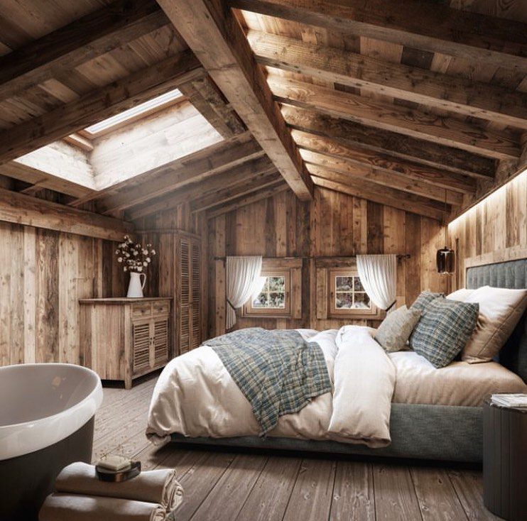 Cozy attic bedroom with wooden beams and rustic interiors