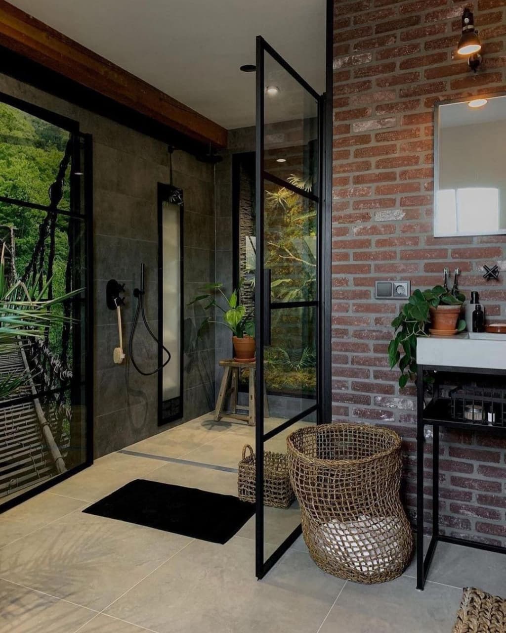 A bathroom combining industrial and natural elements