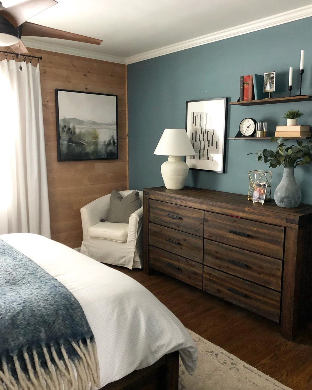 A tastefully decorated bedroom with a serene color palette and thoughtful accents