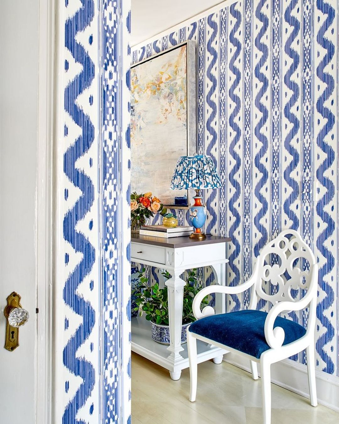 Chic blue and white home office nook with vibrant patterns