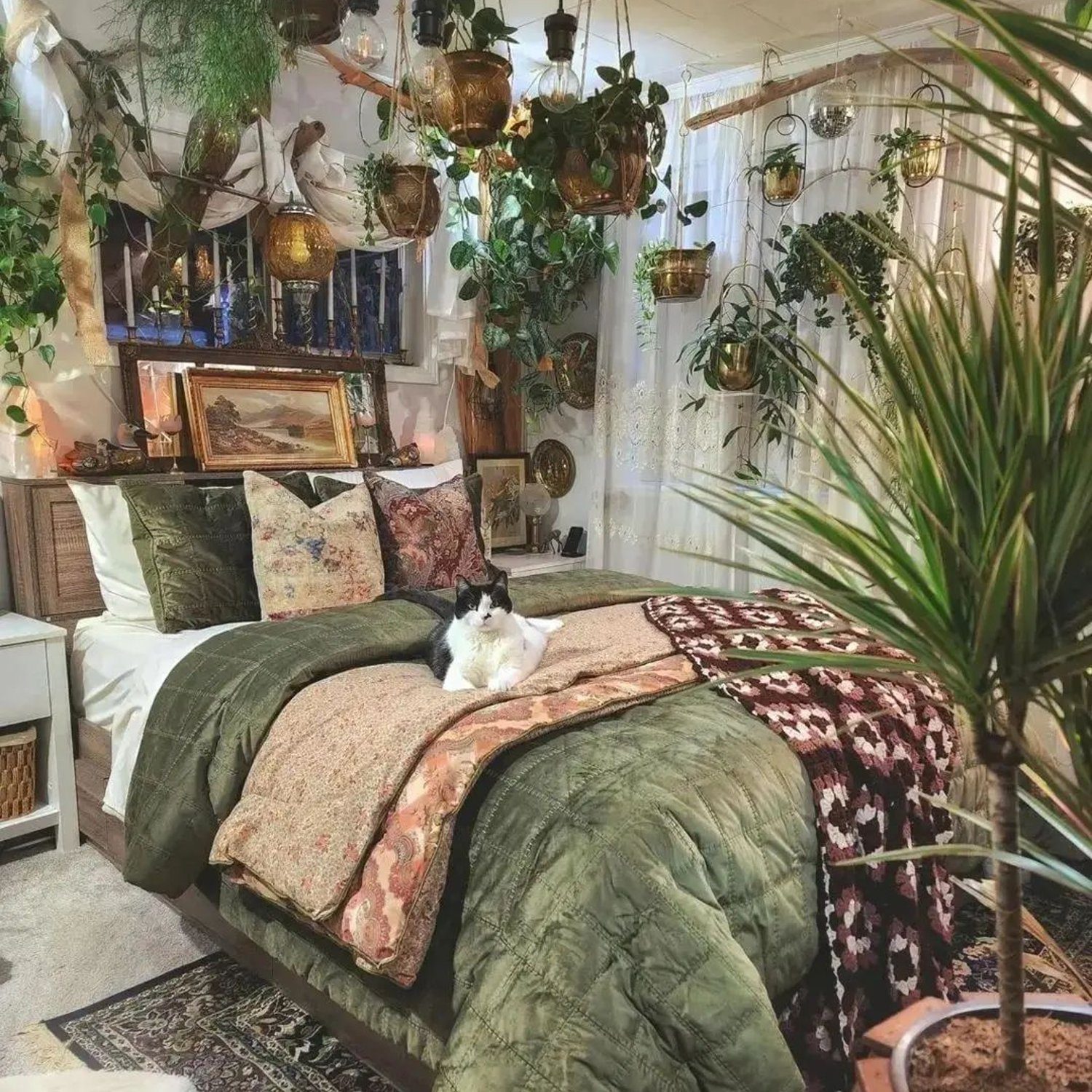 A cozy botanical-themed bedroom with a lounging cat