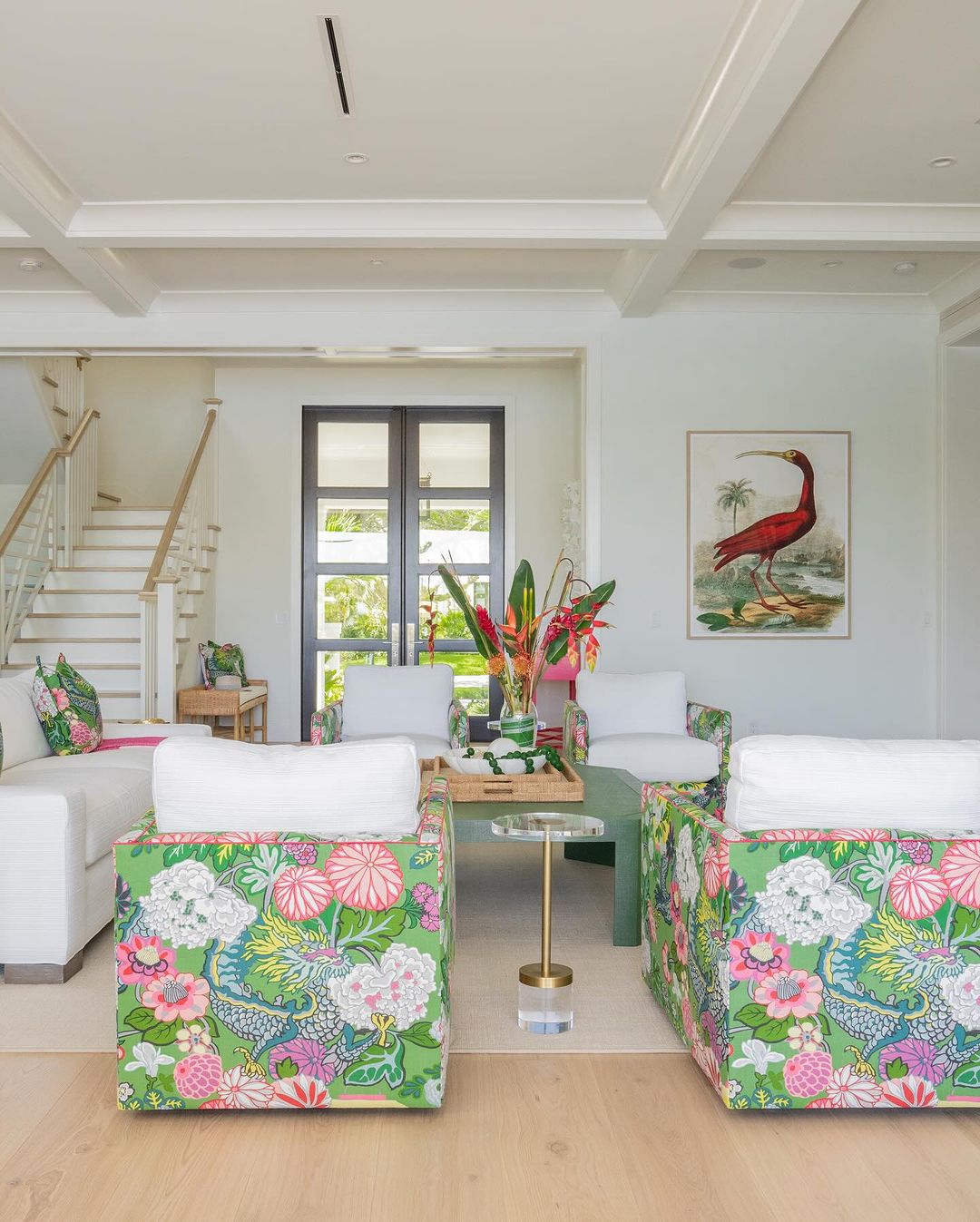 A bright and welcoming living room featuring a staircase