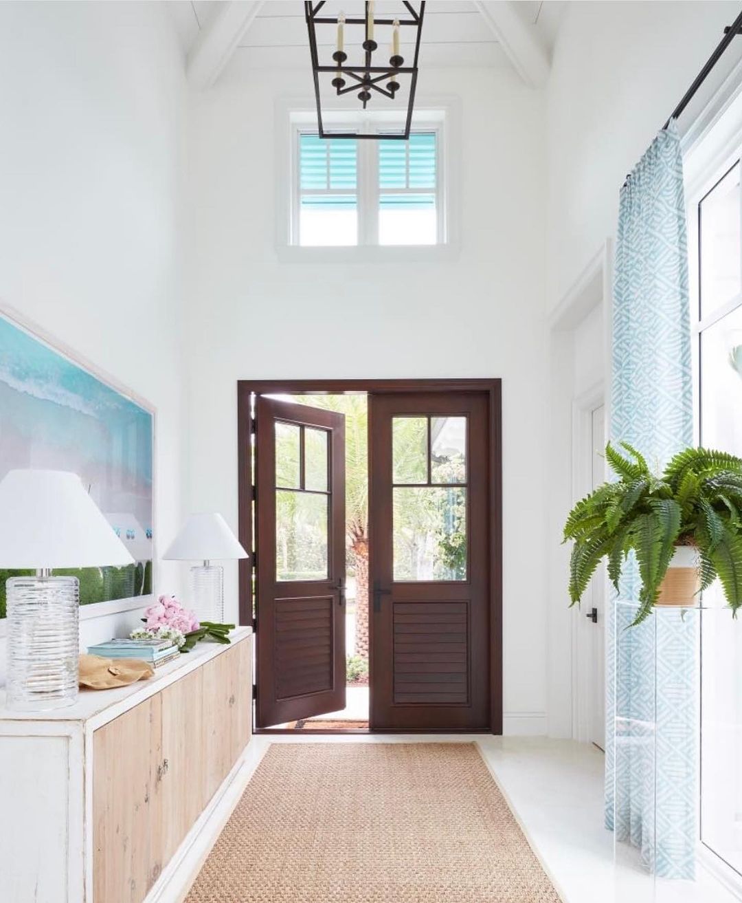 Bright and airy entryway with open double doors and natural light