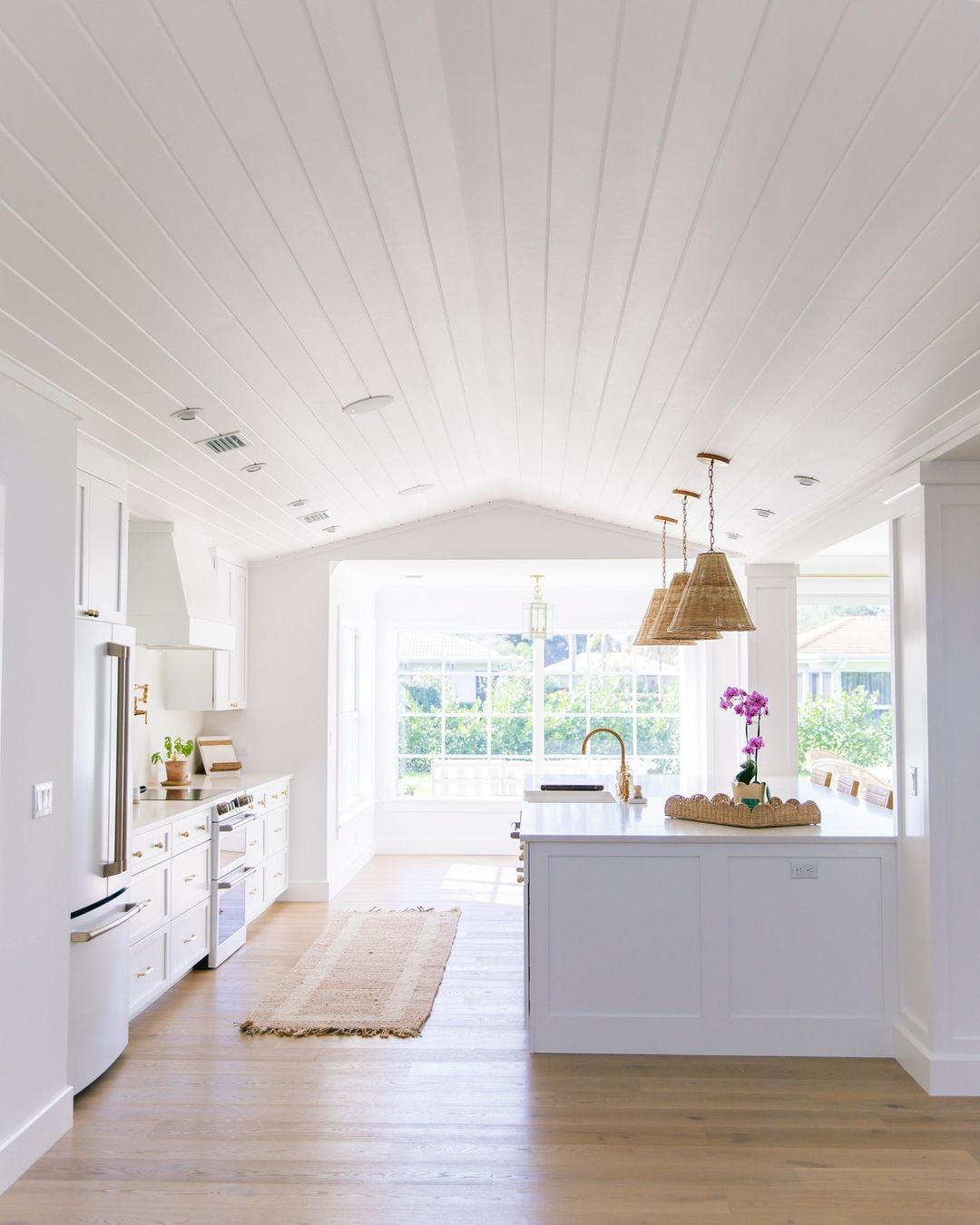 Bright and airy kitchen with vaulted white ceiling