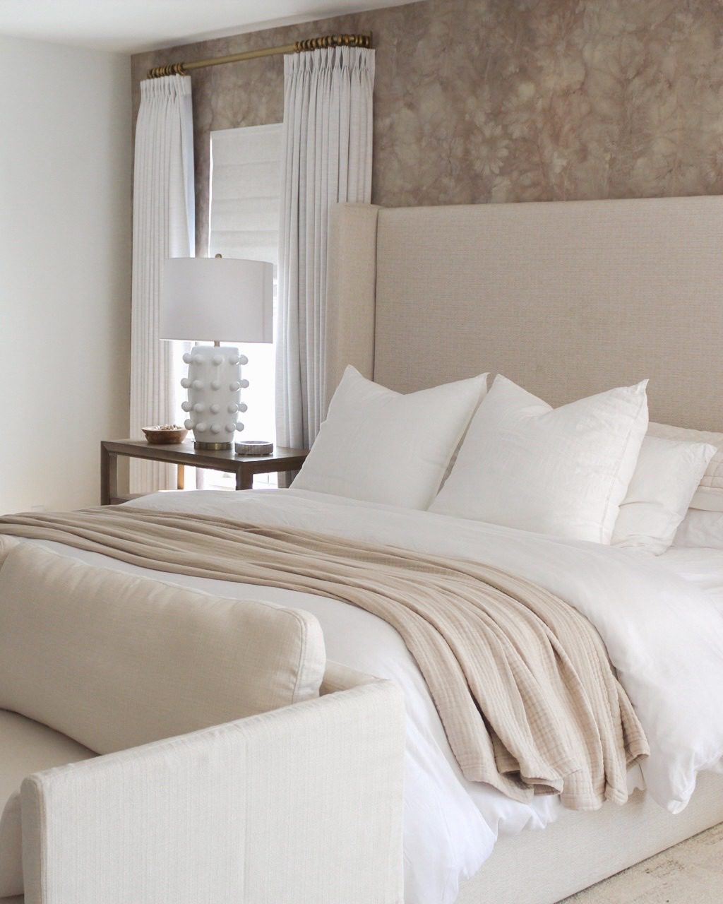 A serene and tastefully decorated bedroom with a focus on simplicity and comfort