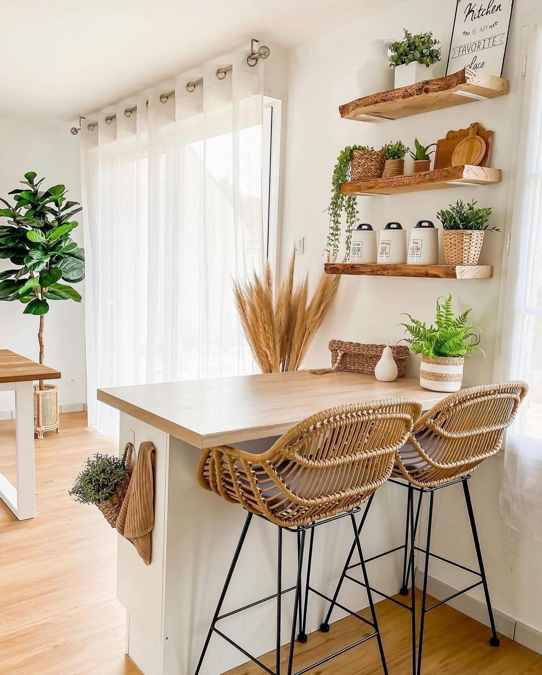 A cozy and inviting kitchen nook featuring natural wood elements and greenery