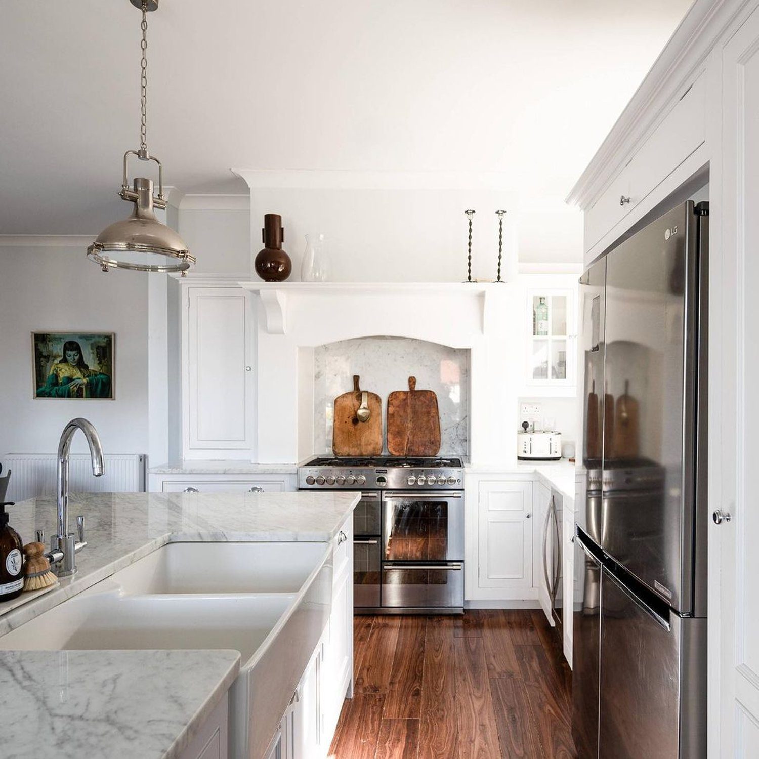 Elegant white kitchen with wooden floors