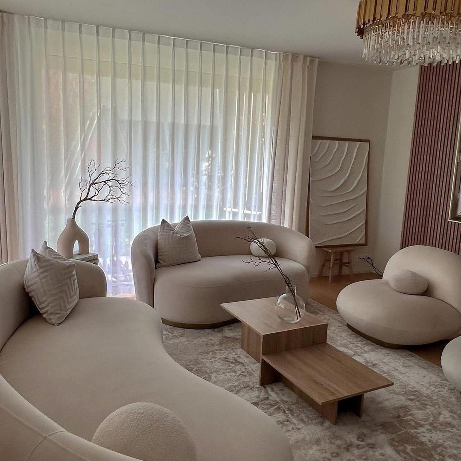 An elegantly designed living room with a harmonious neutral palette