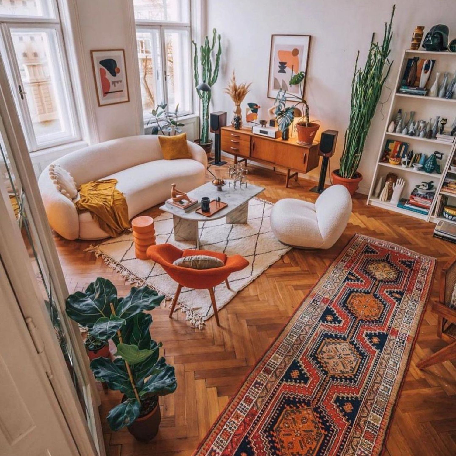 A tastefully decorated living room with a blend of modern and vintage elements