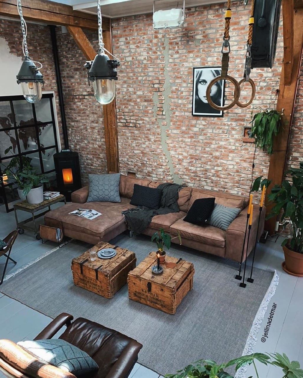 Chic industrial loft living room with exposed brick and wooden beams