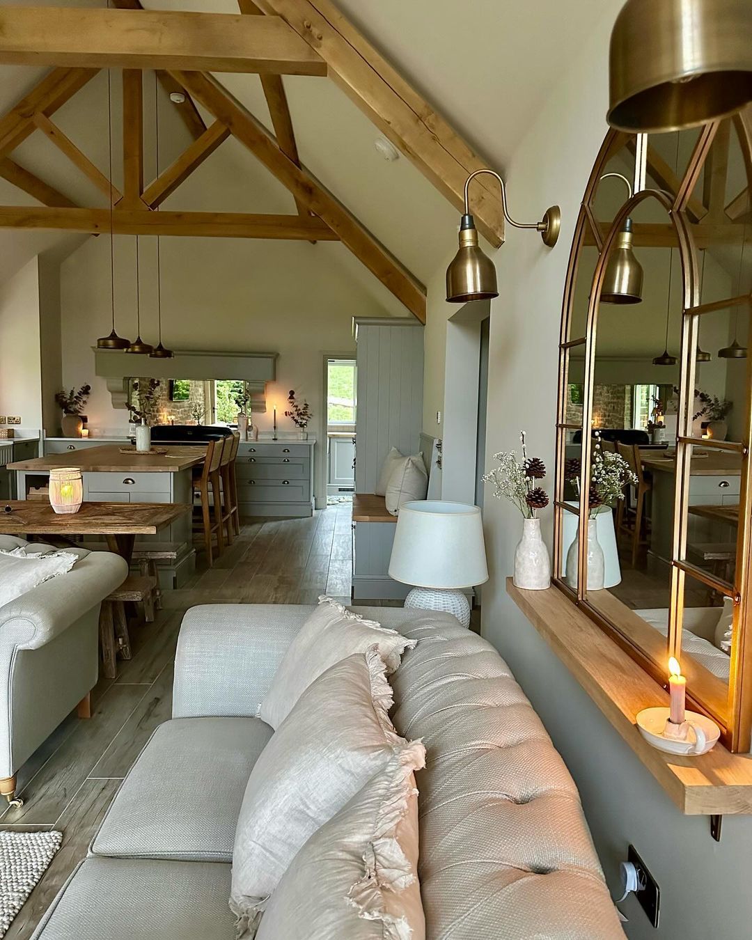 A cozy and chic living room with exposed wooden beams