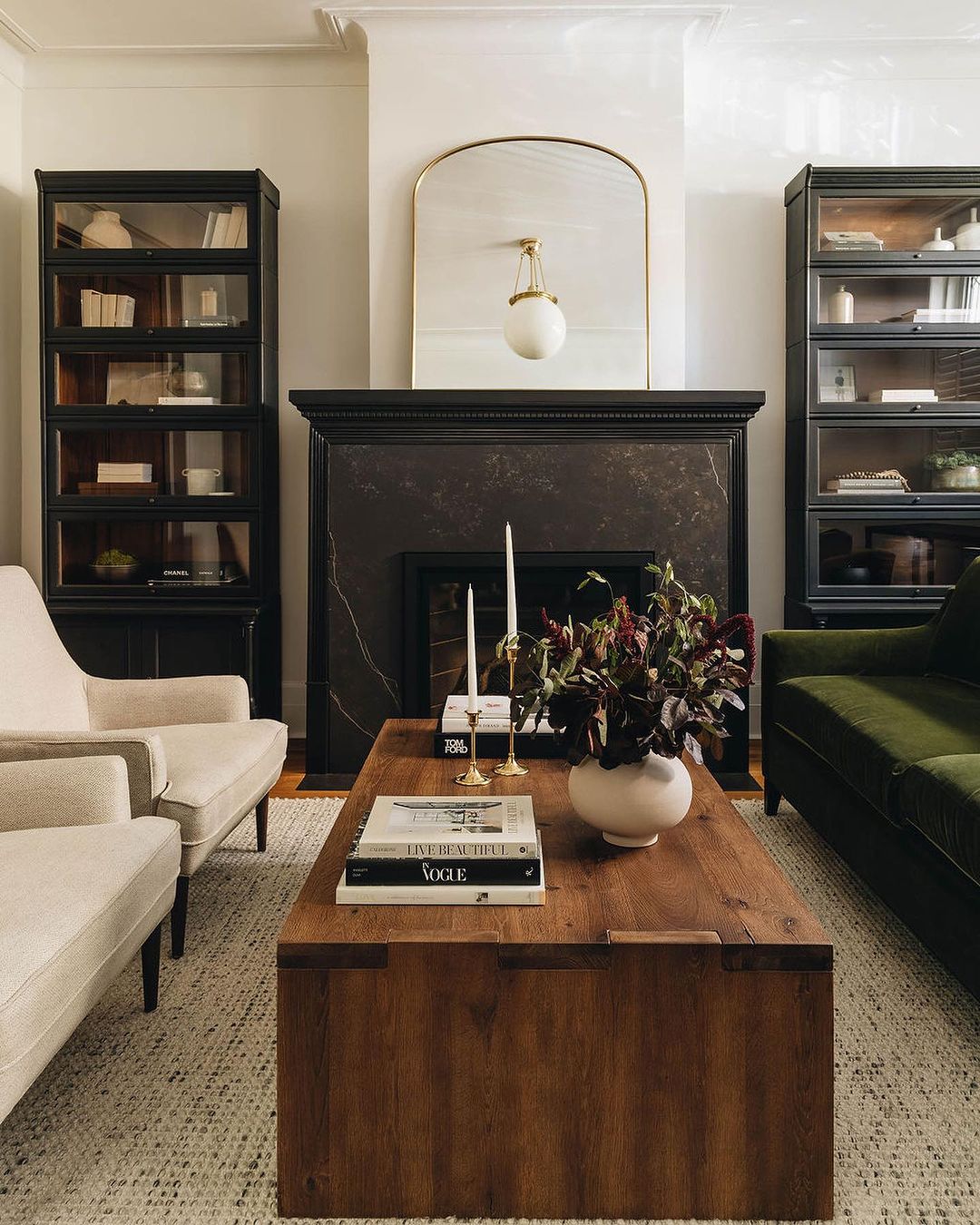 A chic and stylish living room centered around a bold wooden coffee table.