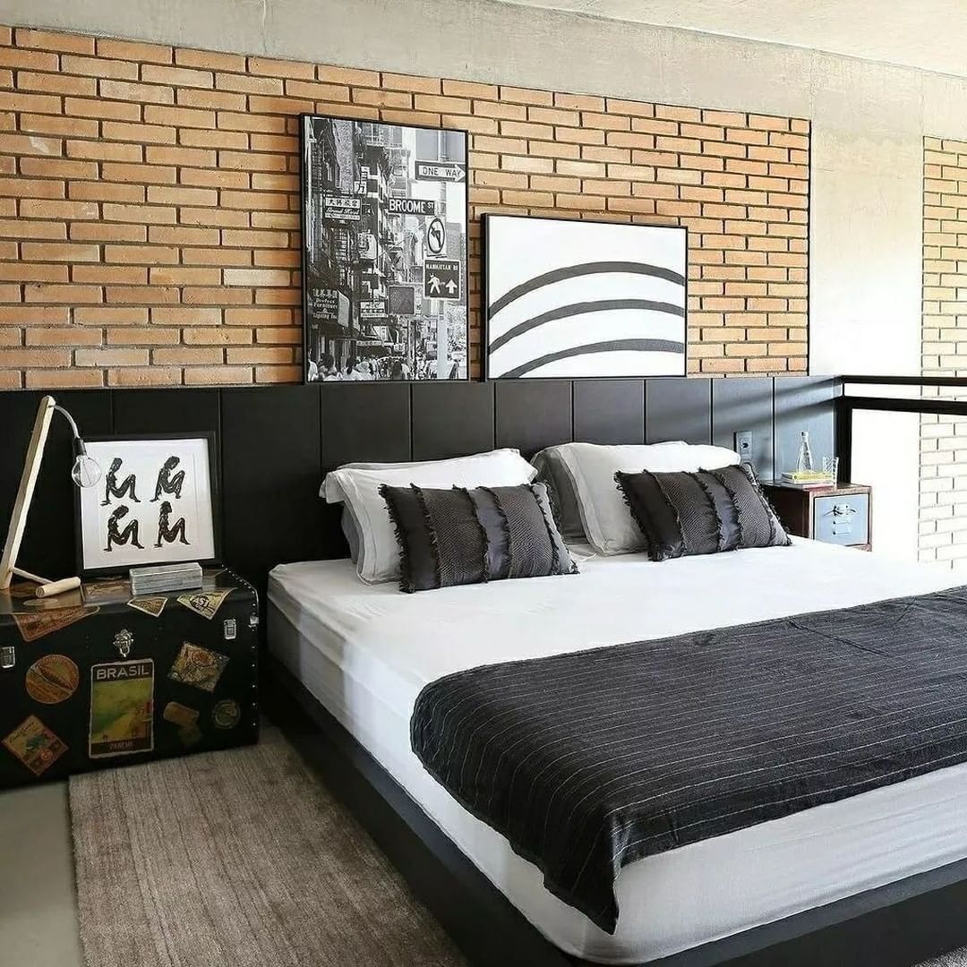 Chic urban bedroom with exposed brick accent wall